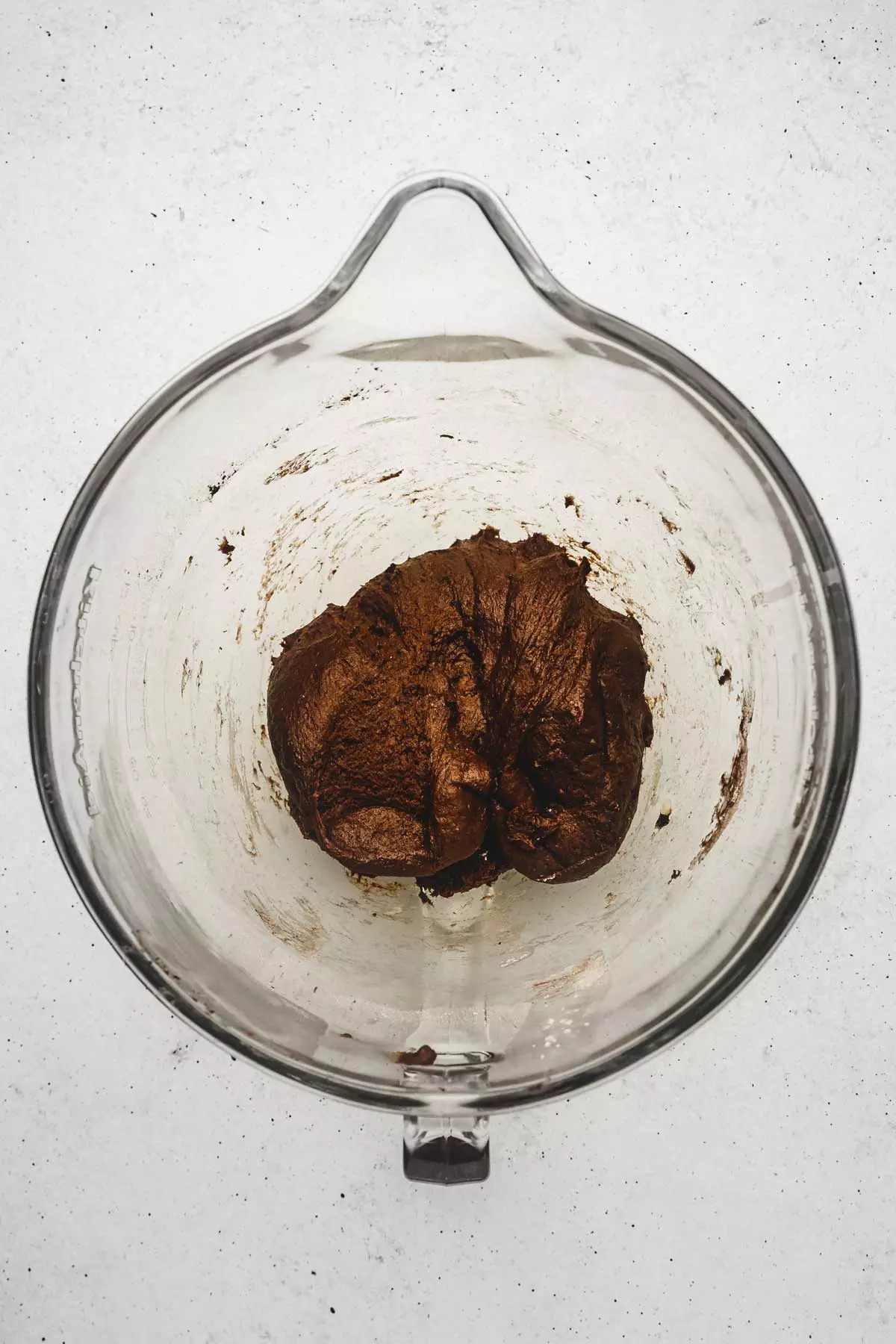 Chocolate brioche dough in a mixing bowl