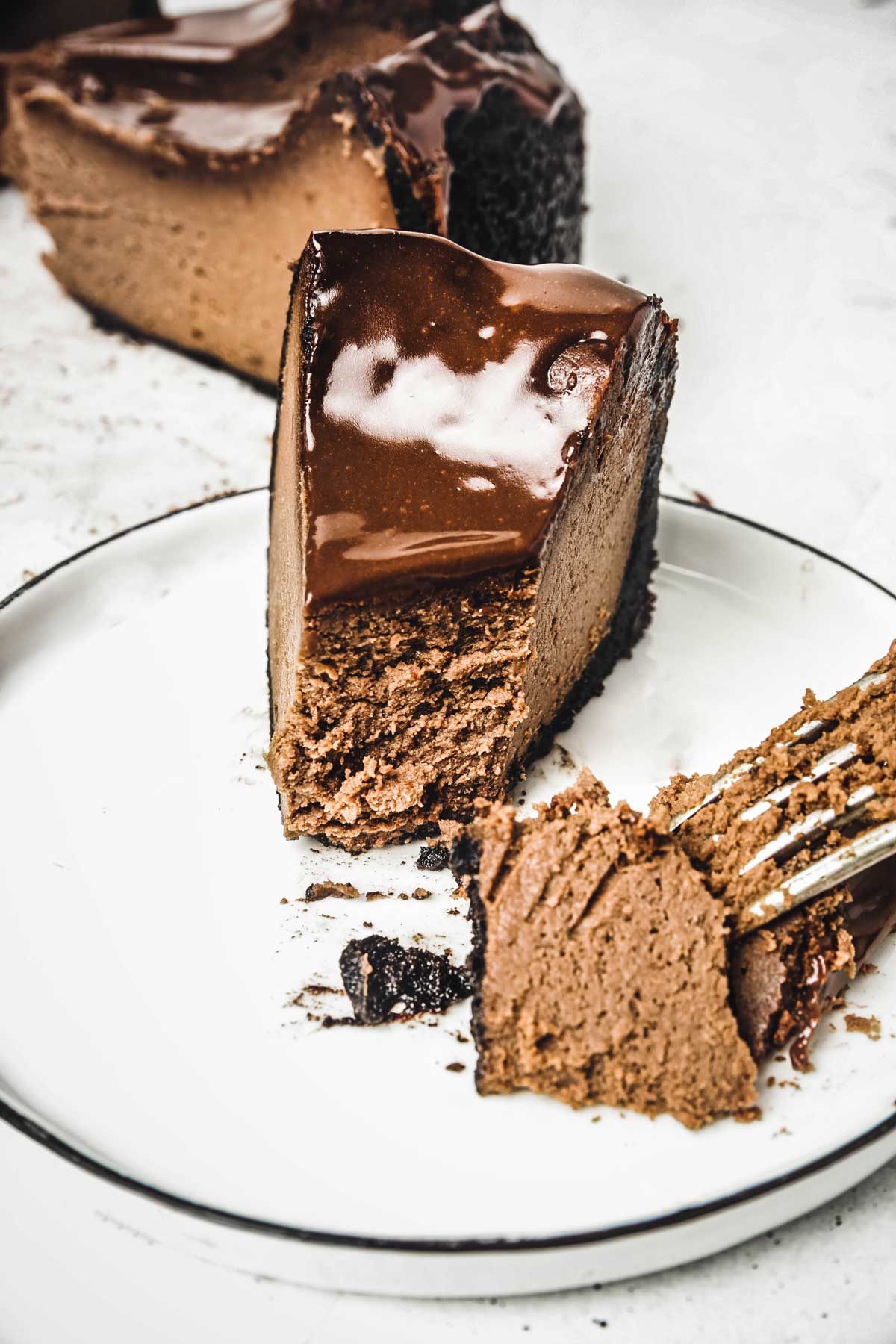 Chocolate cheesecake on a plate with a fork