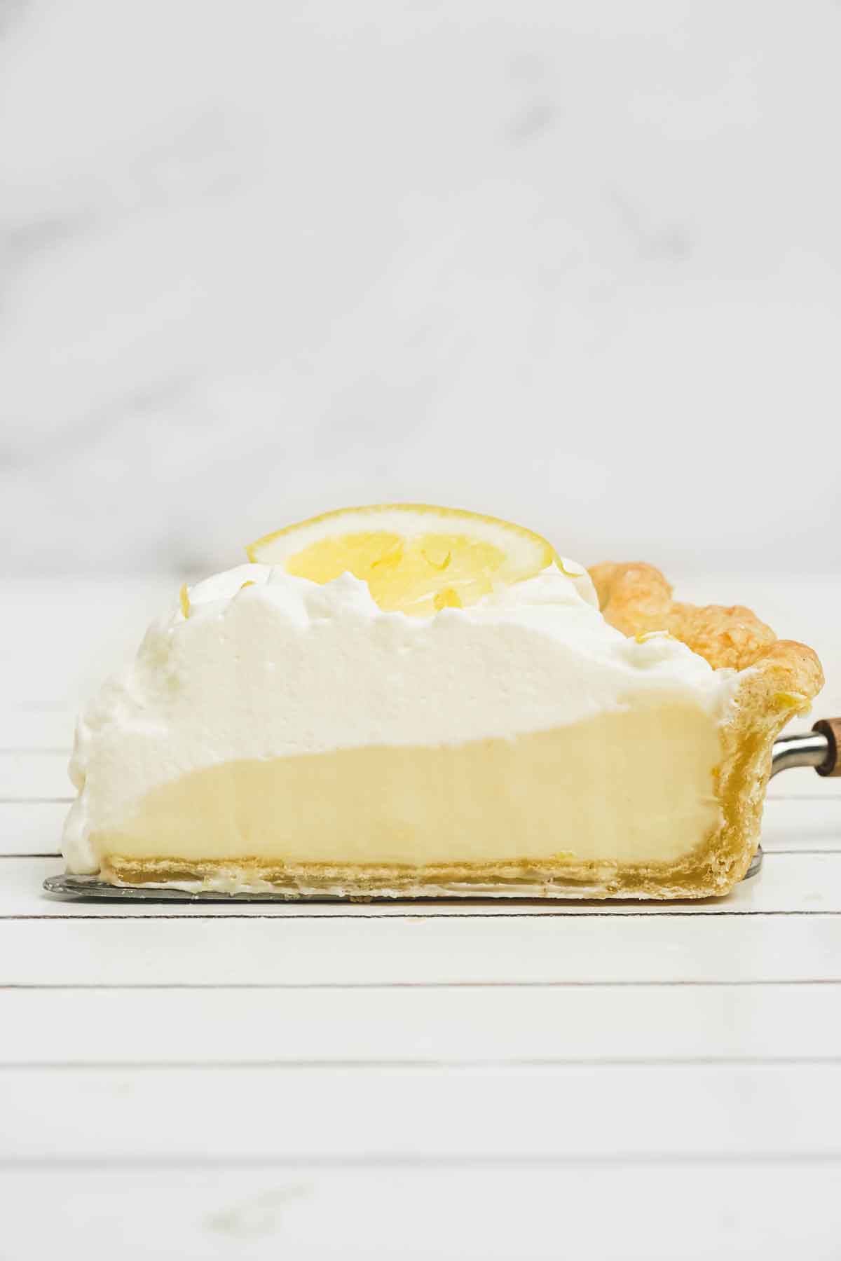 sliced condensed milk lemon pie on a table