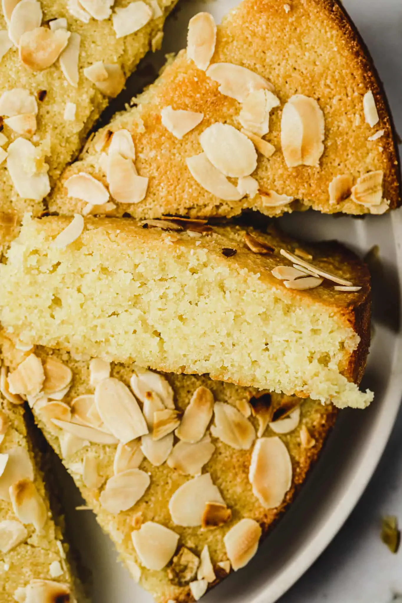 Almond cake cut in slices on a plate