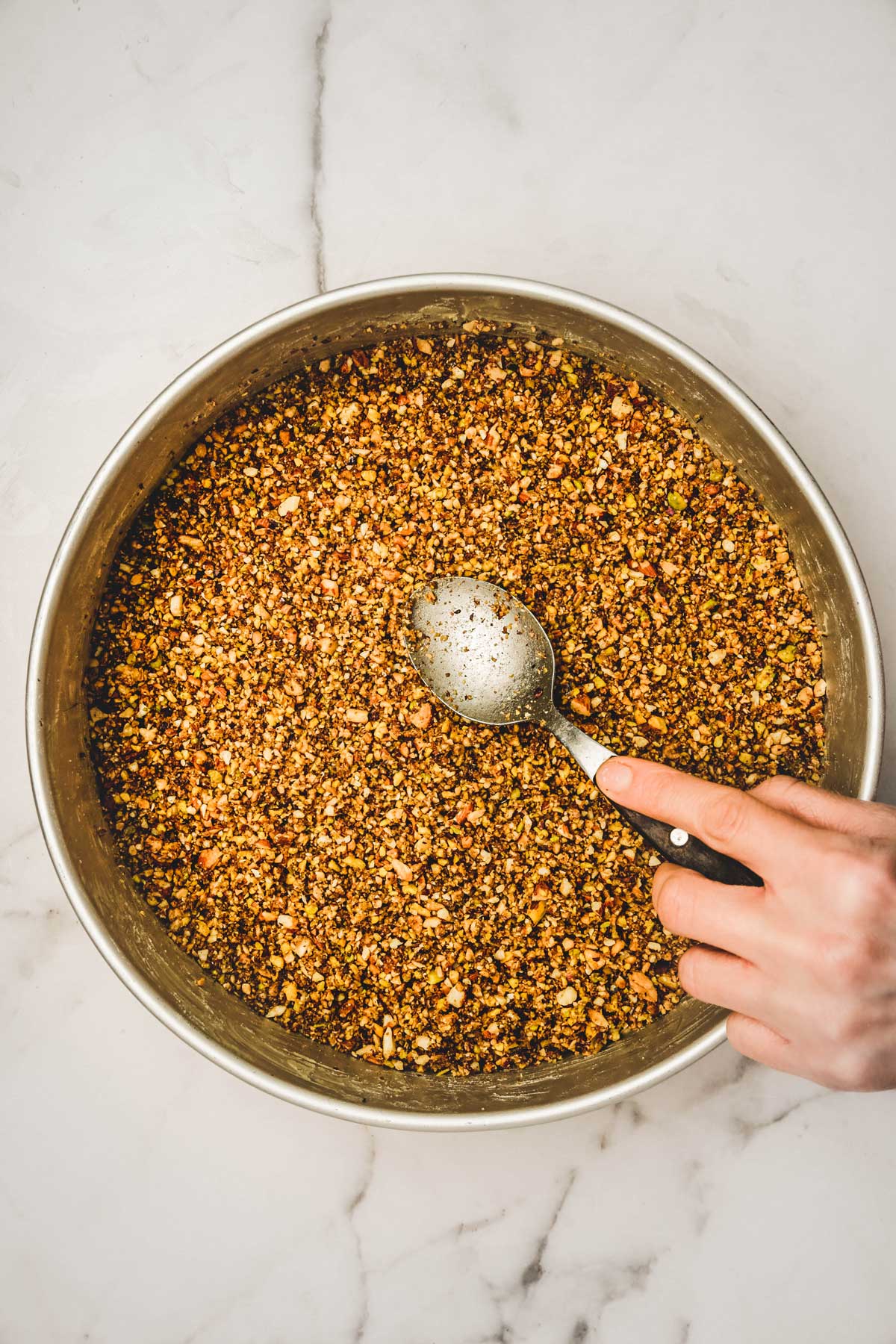 baking pan with a layer of nut mixture