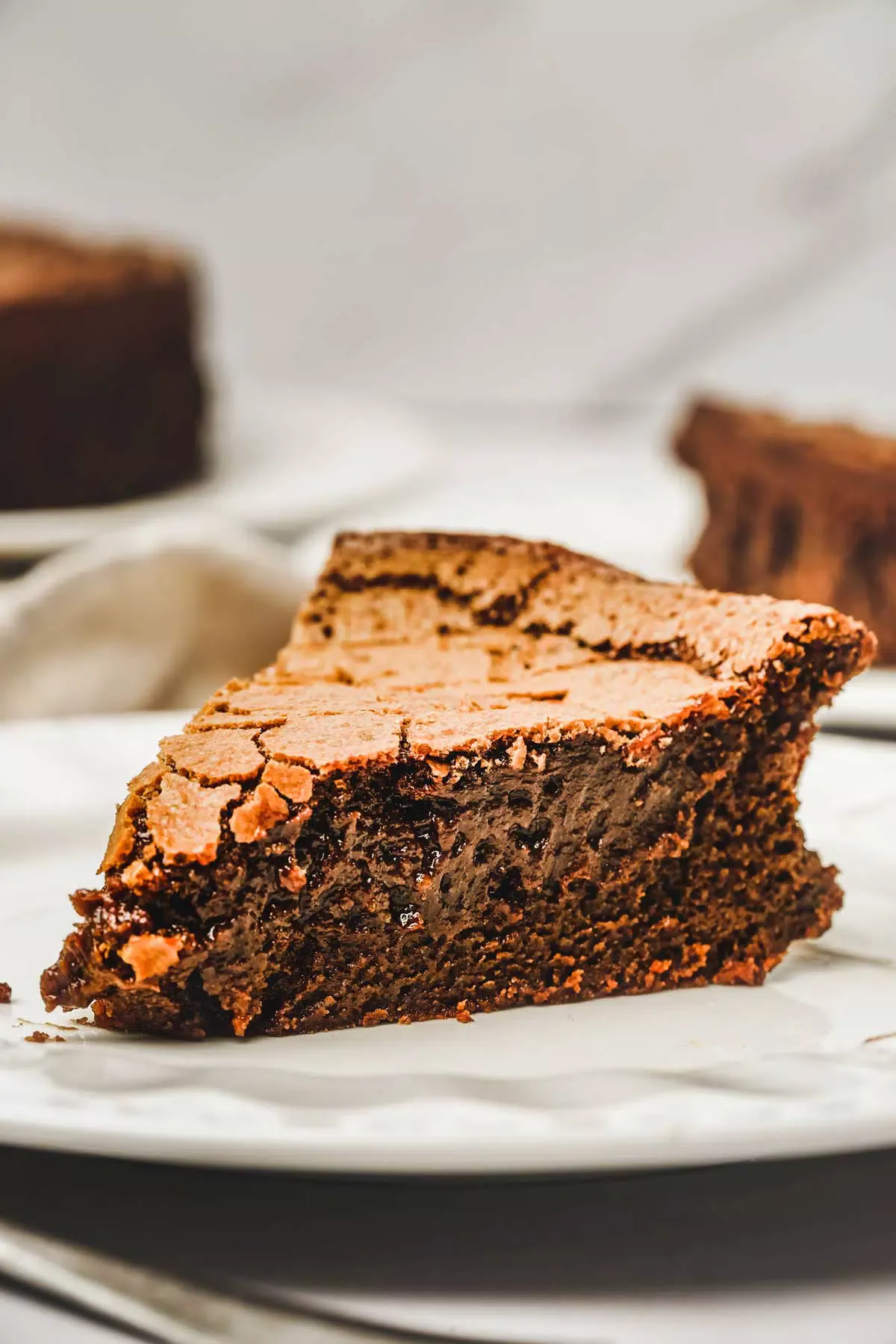 Slice of chocolat fondant cake on a table