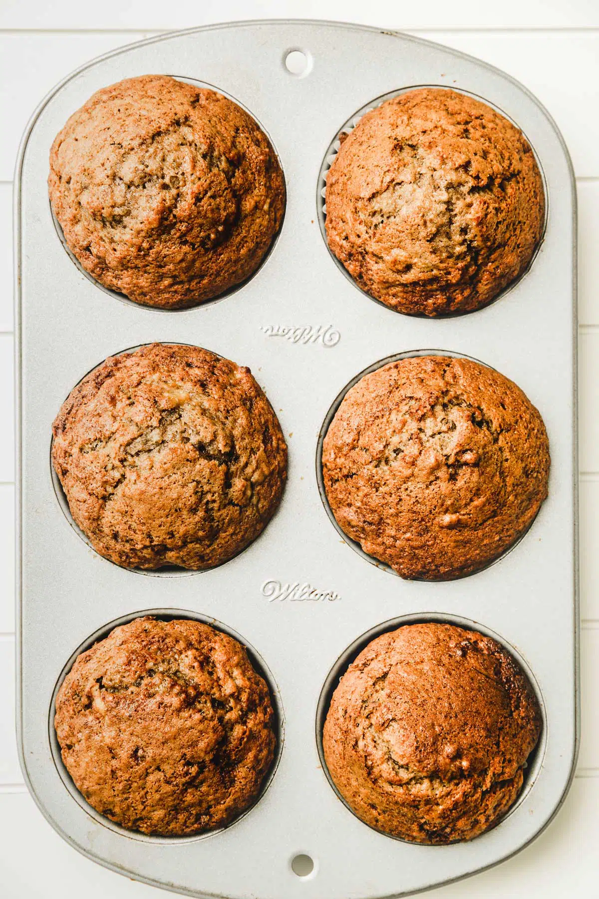 Muffin pan with baked muffins