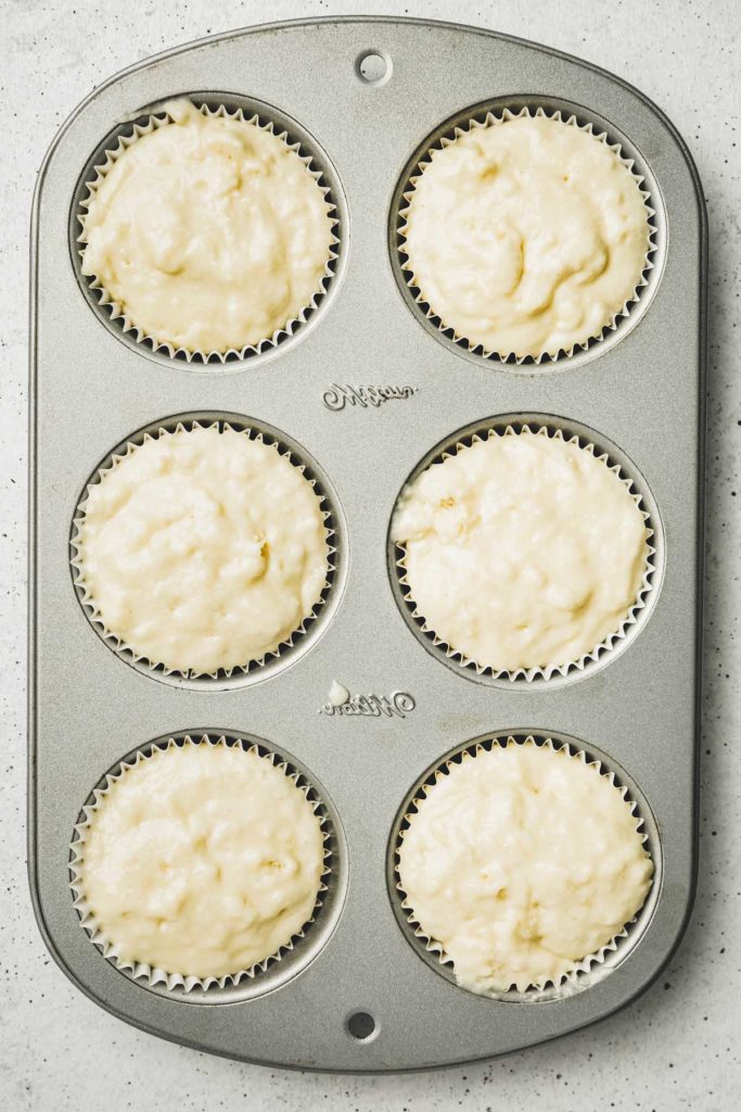 Cupcake mold with muffin batter