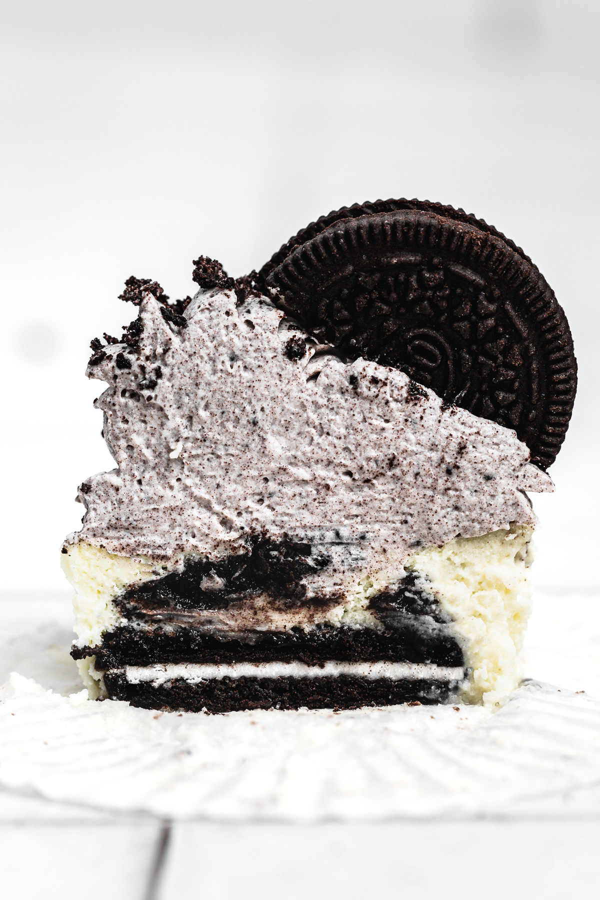 mini oreo cheesecake cut in half showing the creamy center