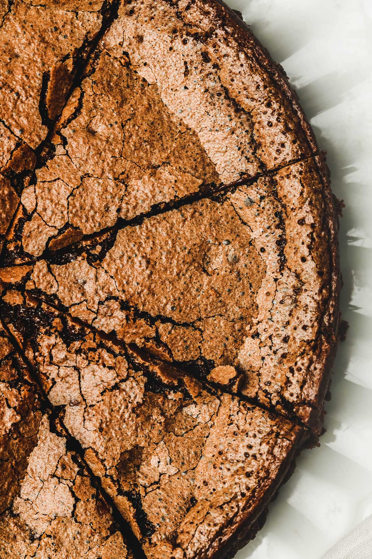 Chocolate fondant cake cut on a plate