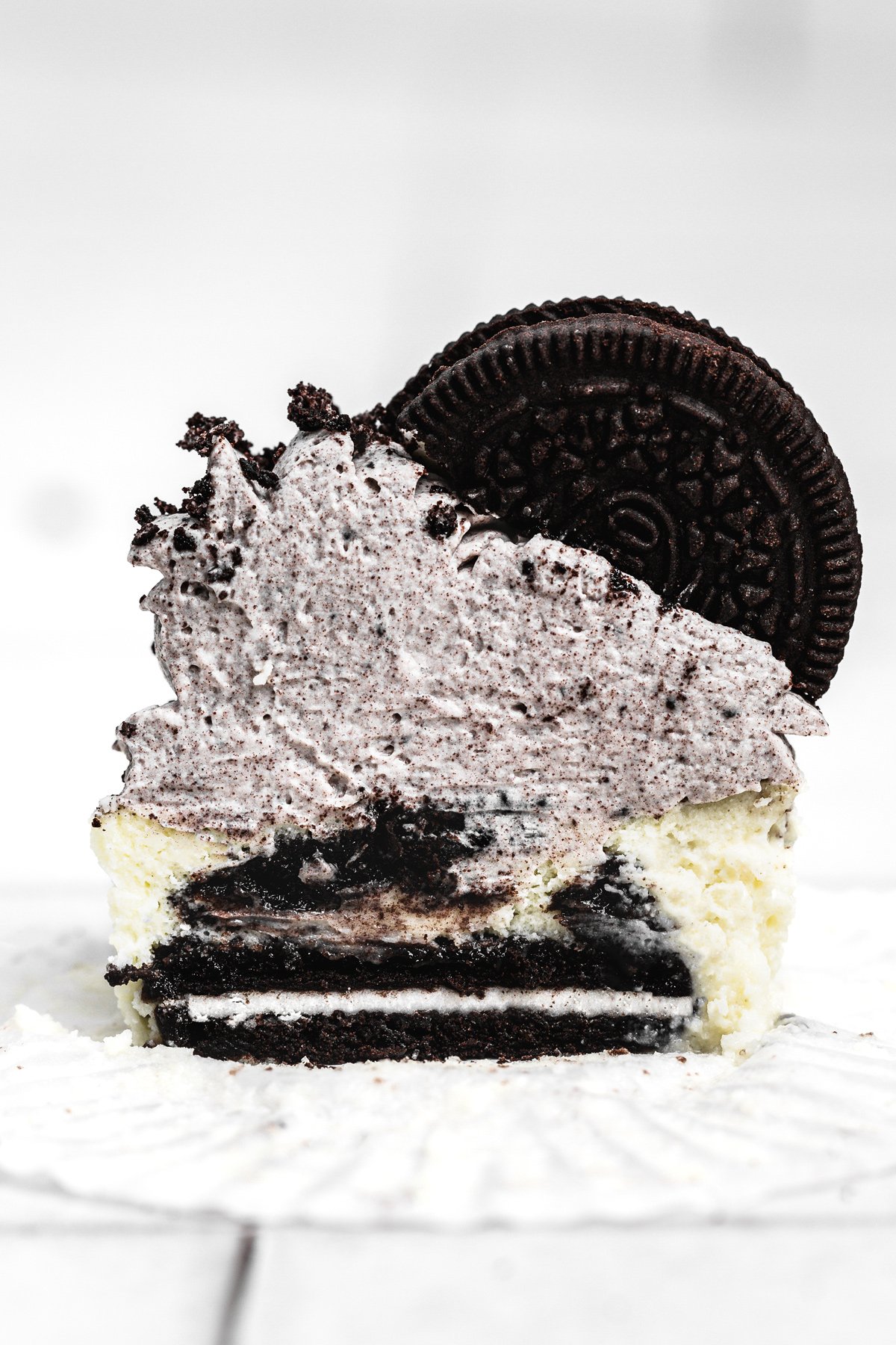 mini oreo cheesecake cut in half showing the creamy center