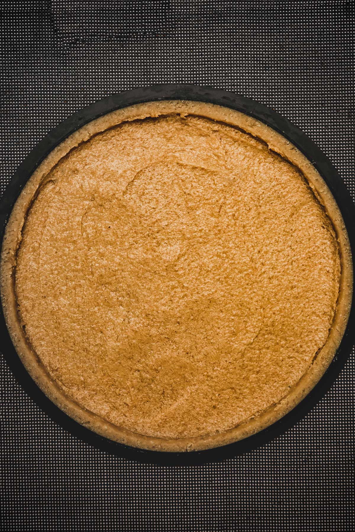 tart pan filled with a tart dough and almond cream