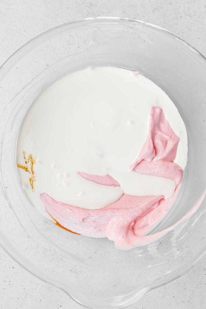 Large bowl with ingredients for strawberry cheesecake