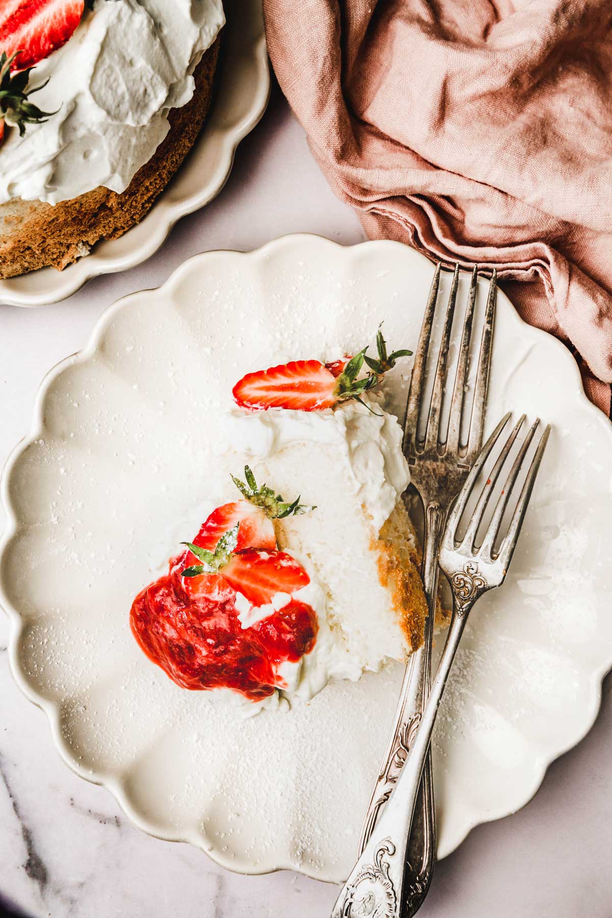 plate with a slice of strawberry angel food cake