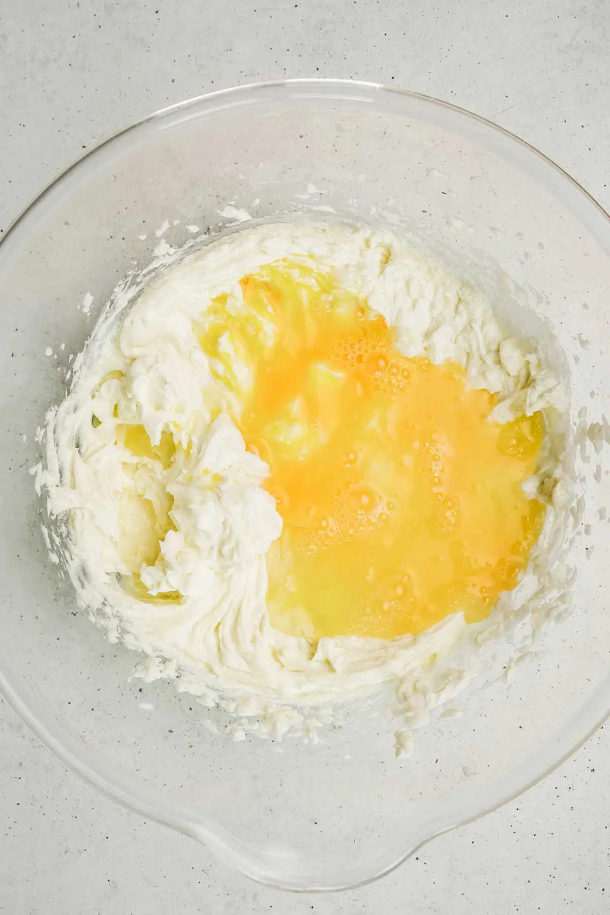 mixing bowl with cream cheese and egg mixture