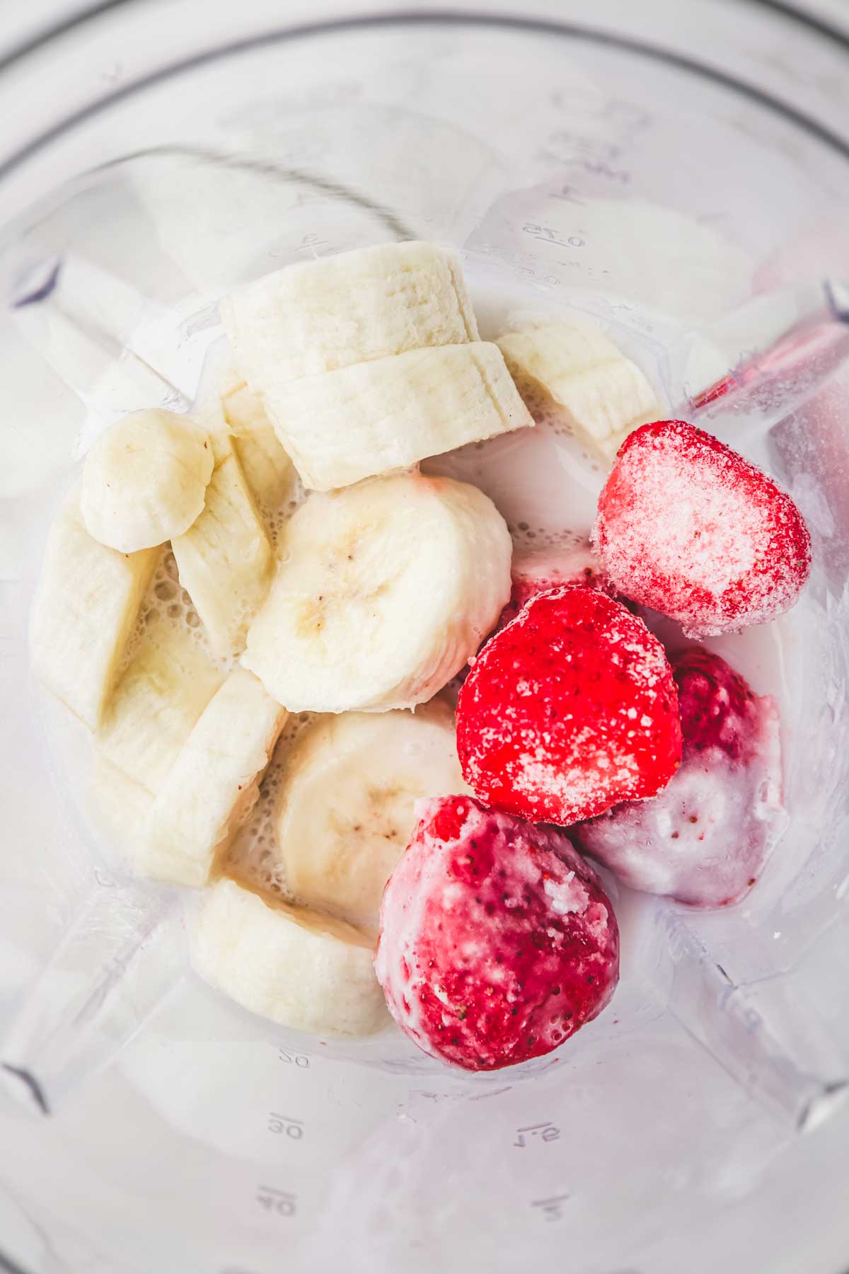Blender with banana and strawberry