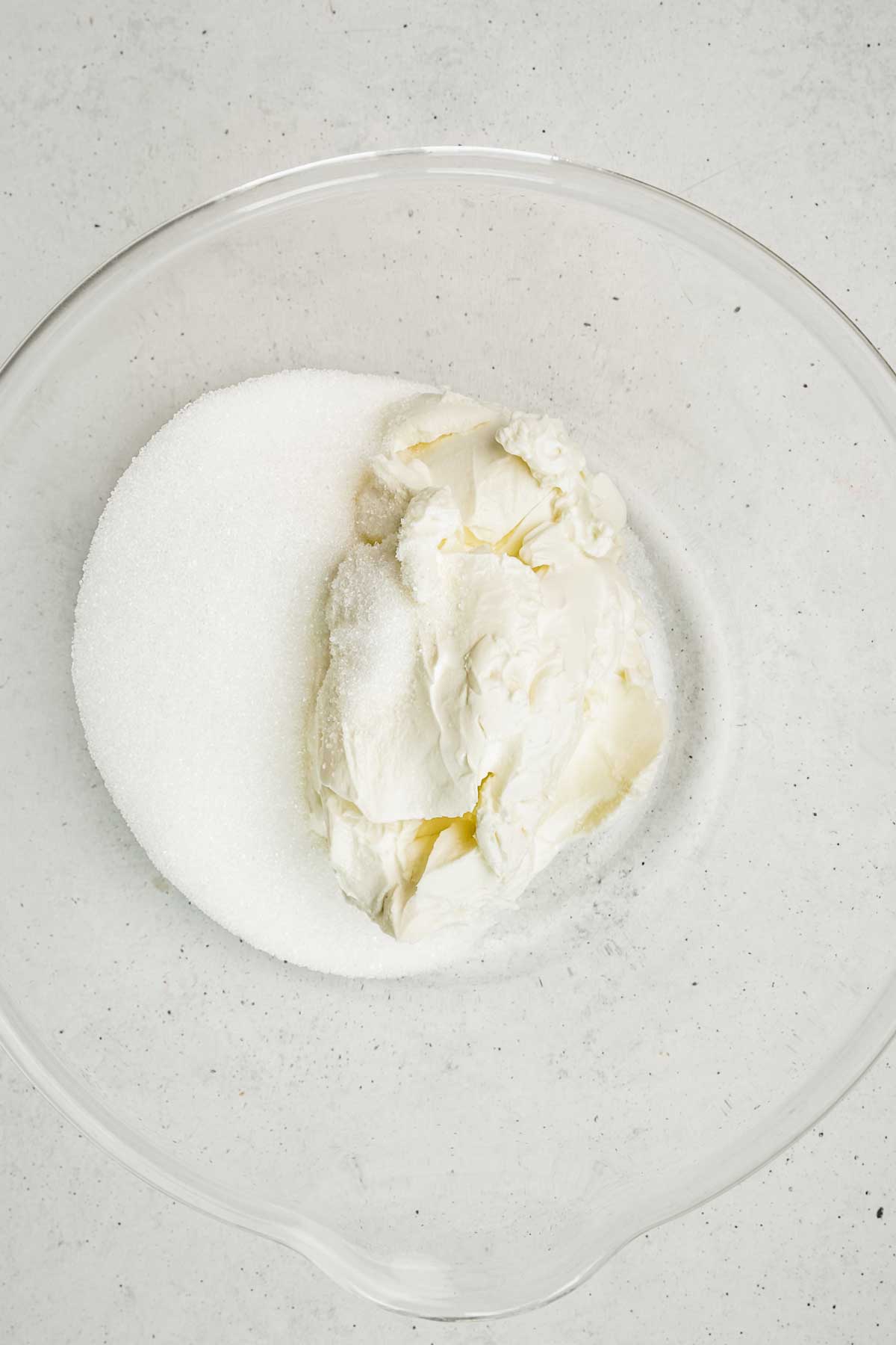 mixing bowl with sugar and cream cheese