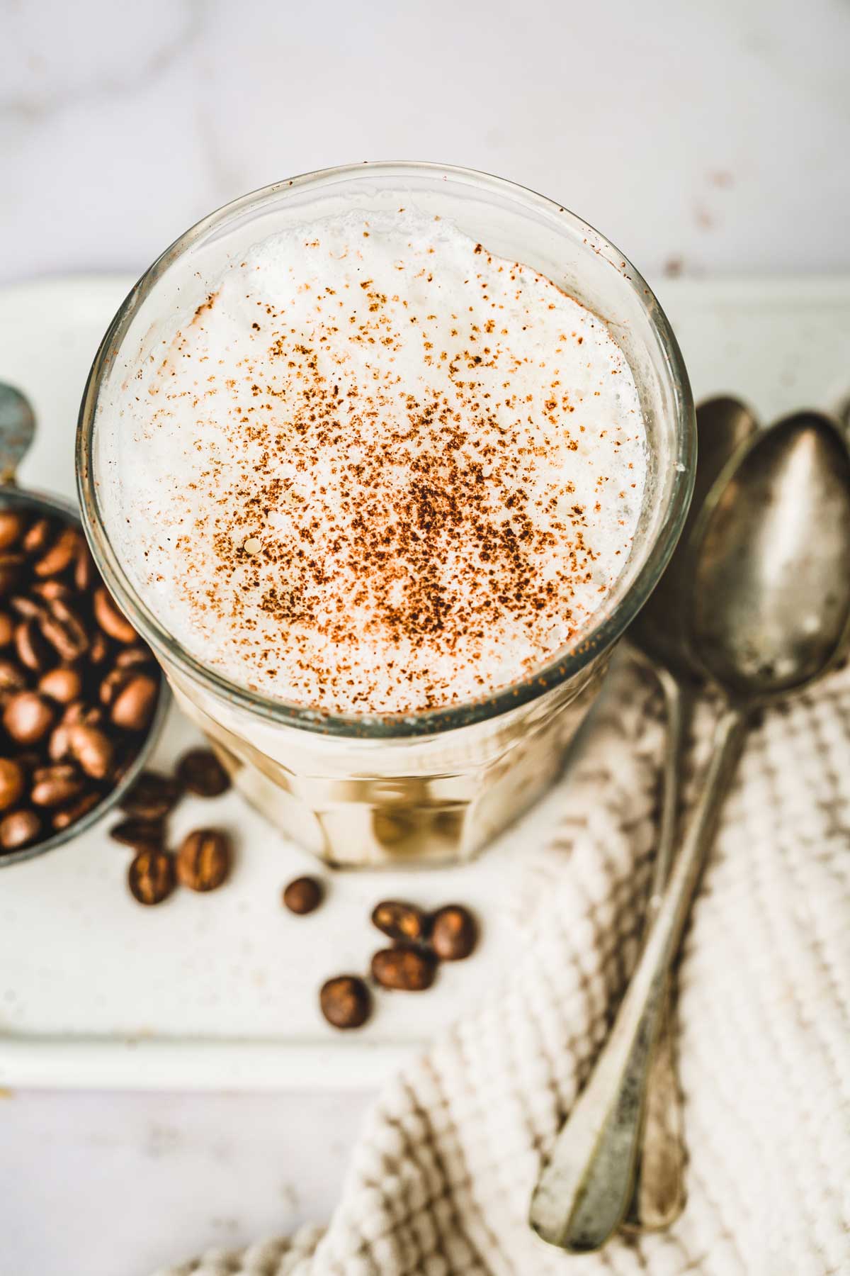 Glass with milk foam and cacao powder