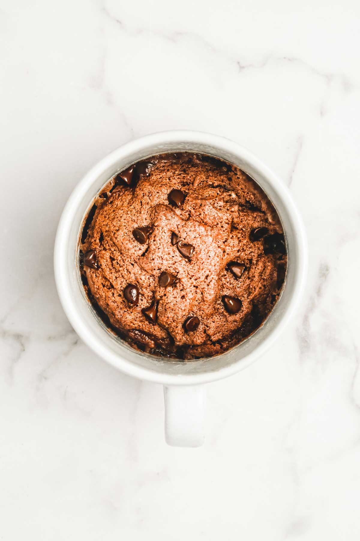 Baked hot cocoa mug cake with chocolate chips