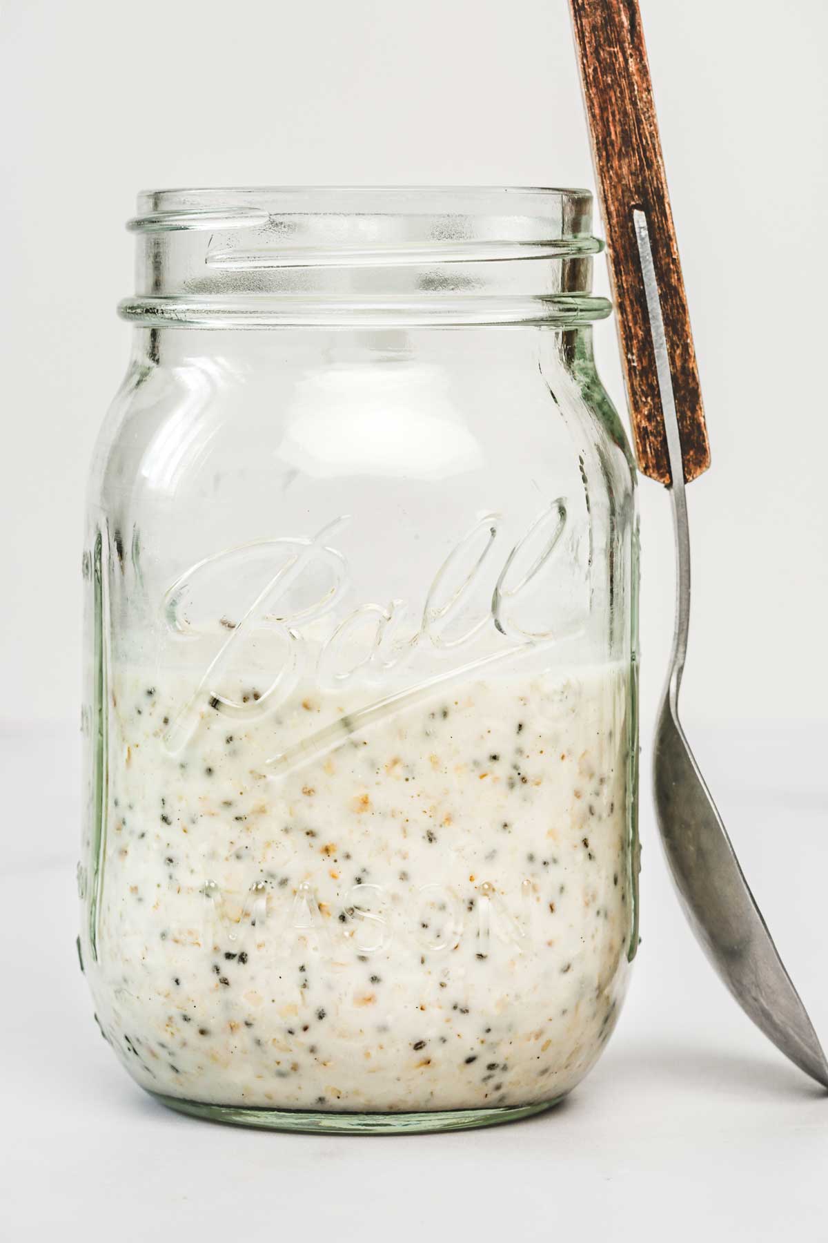 glass jar with ingredients and a tablespoon