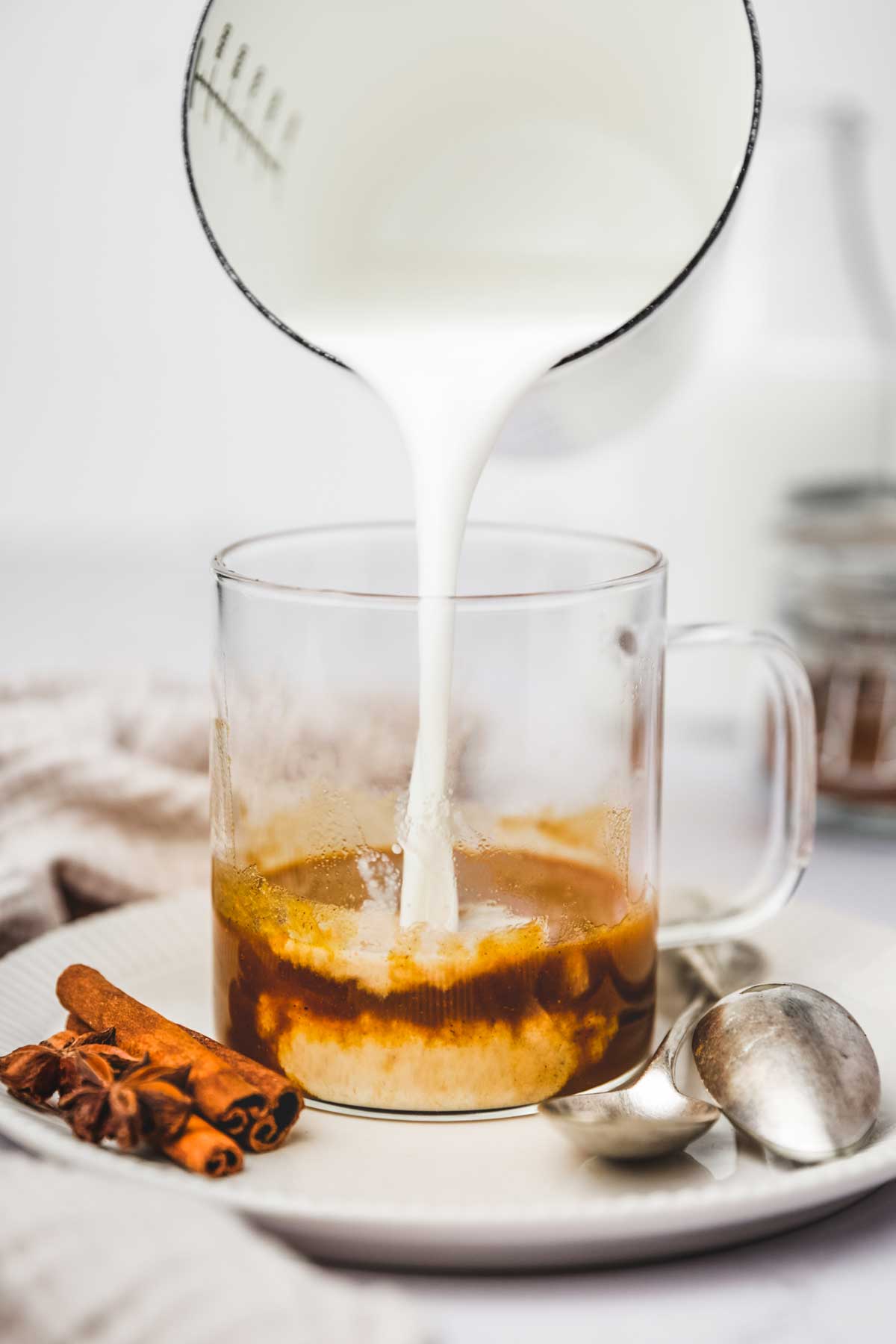 Cup with pumpkin spice mixture and milk