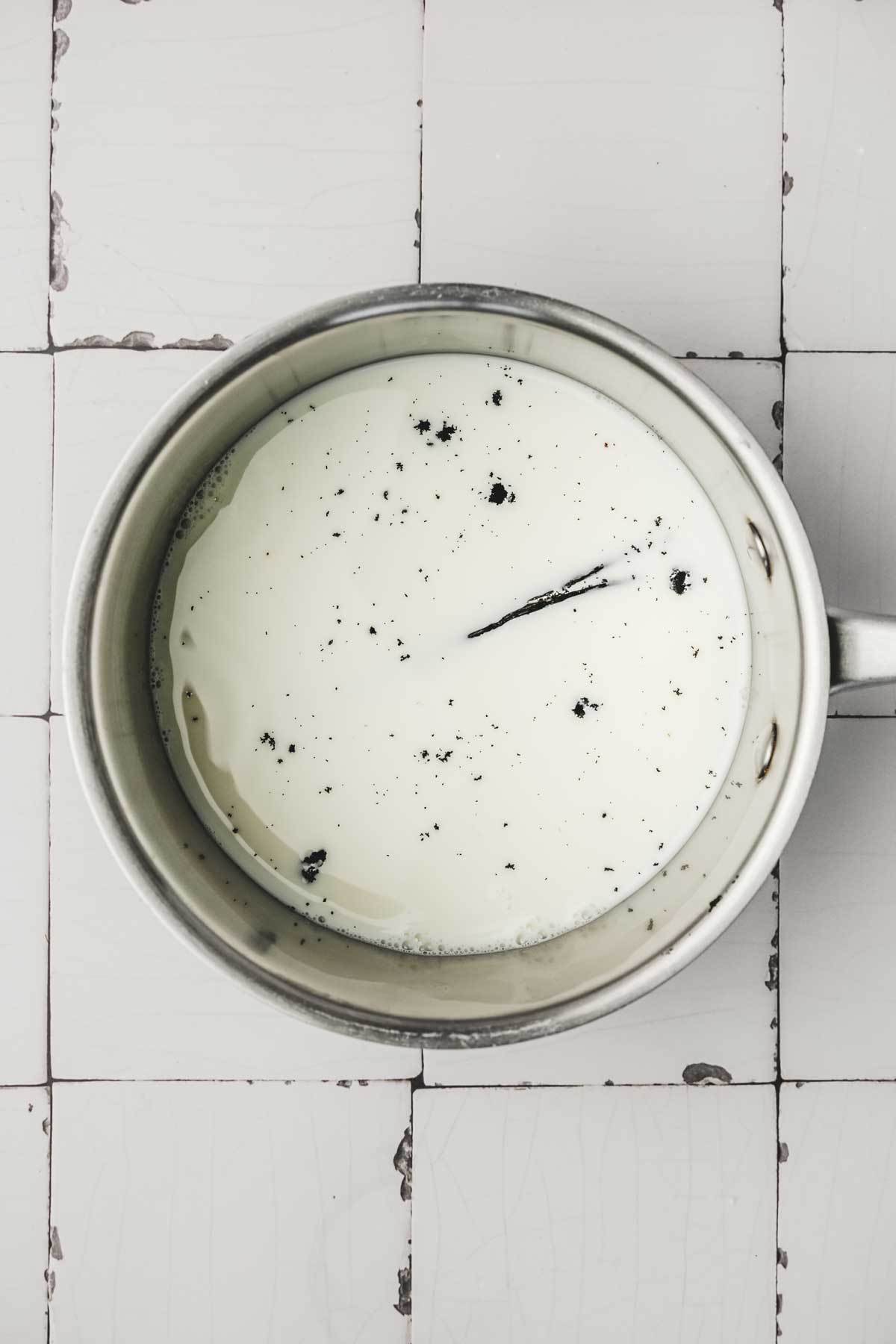 medium saucepan with milk and a vanilla pod