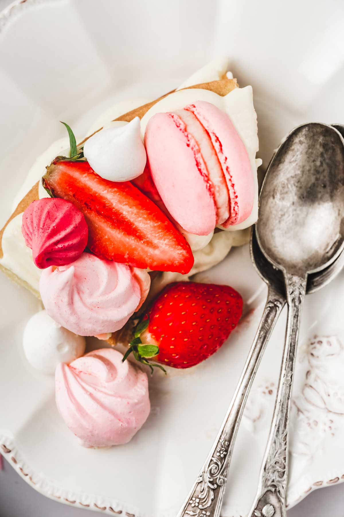 Piece of number cake in a plate with two spoons