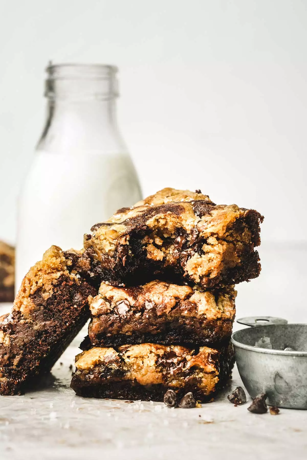 Stack of gooey brookie bars with chocolate chips