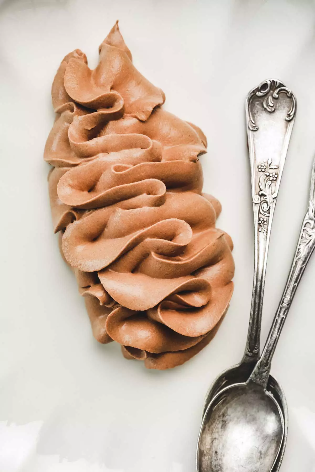 Whipped chocolate ganache with teaspoons