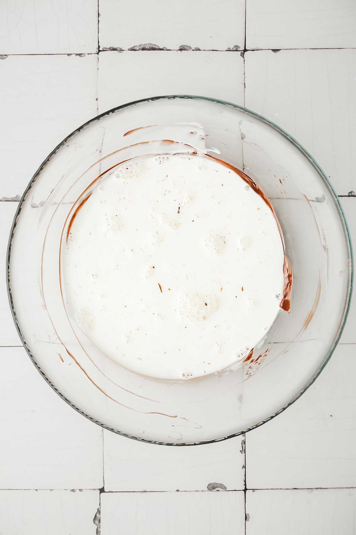 Bowl with chocolate ganache and heavy cream