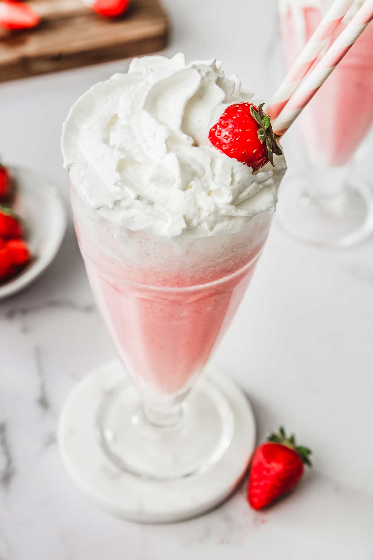Glass on a table with whipped cream