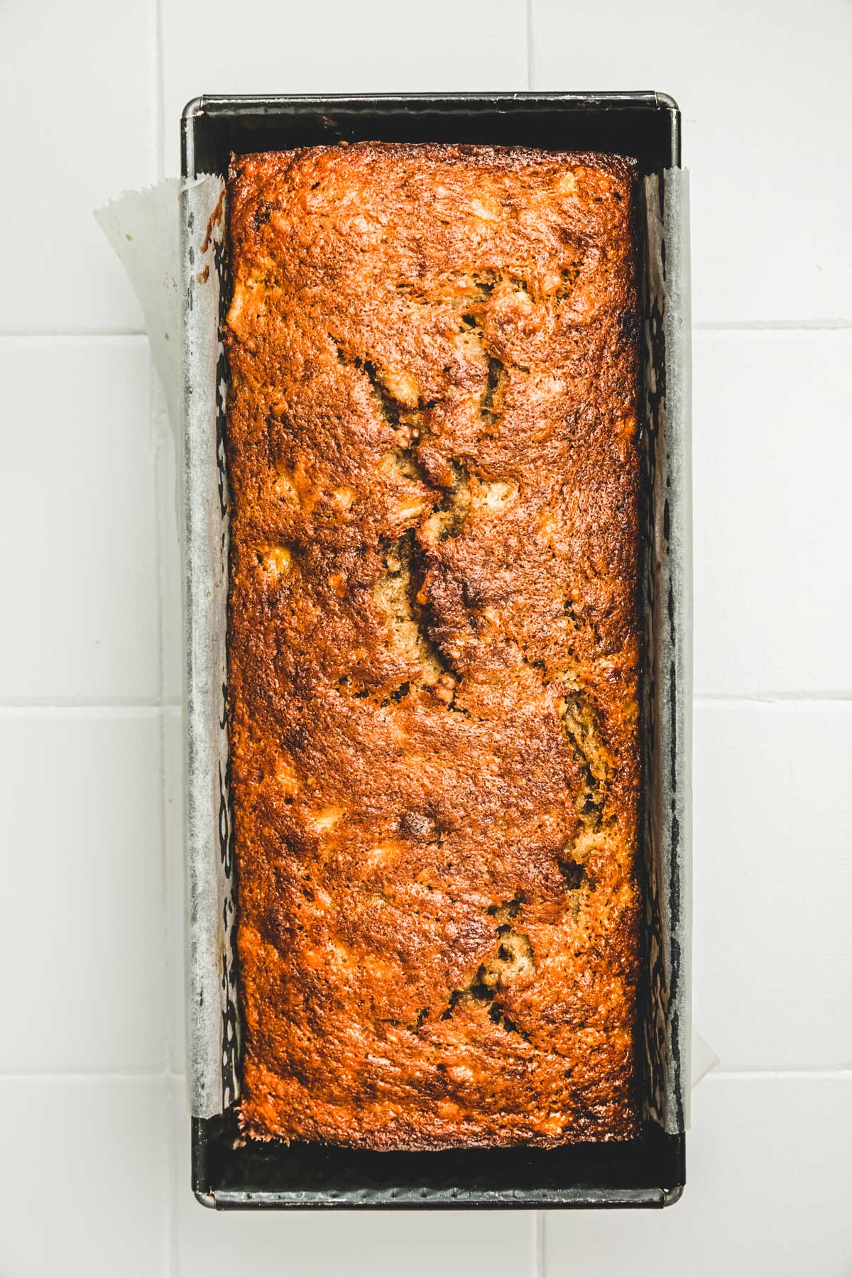 Banana walnut bread in a loaf pan after baking