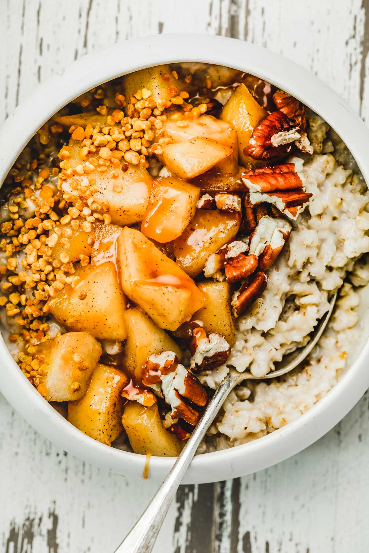 Bowl with cinnamon apple and pecan nut 