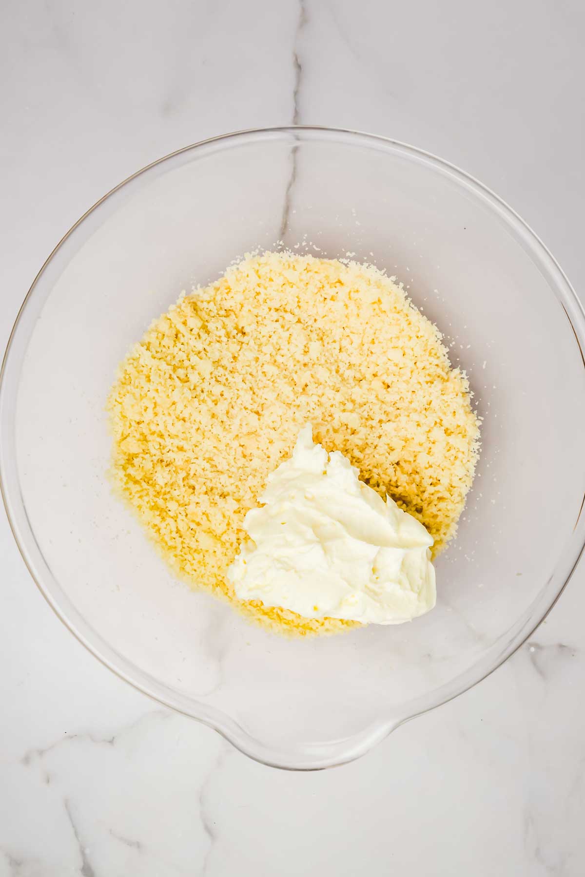 Bowl with cake crumbs and frosting