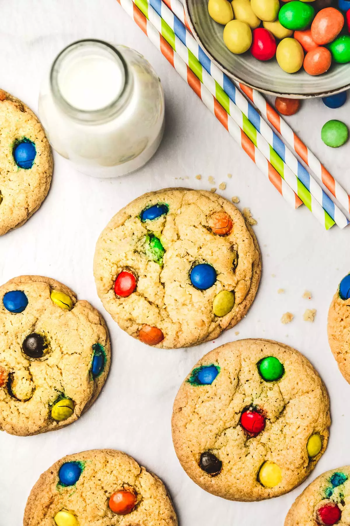 M&m's cookies on a table with straws and candy