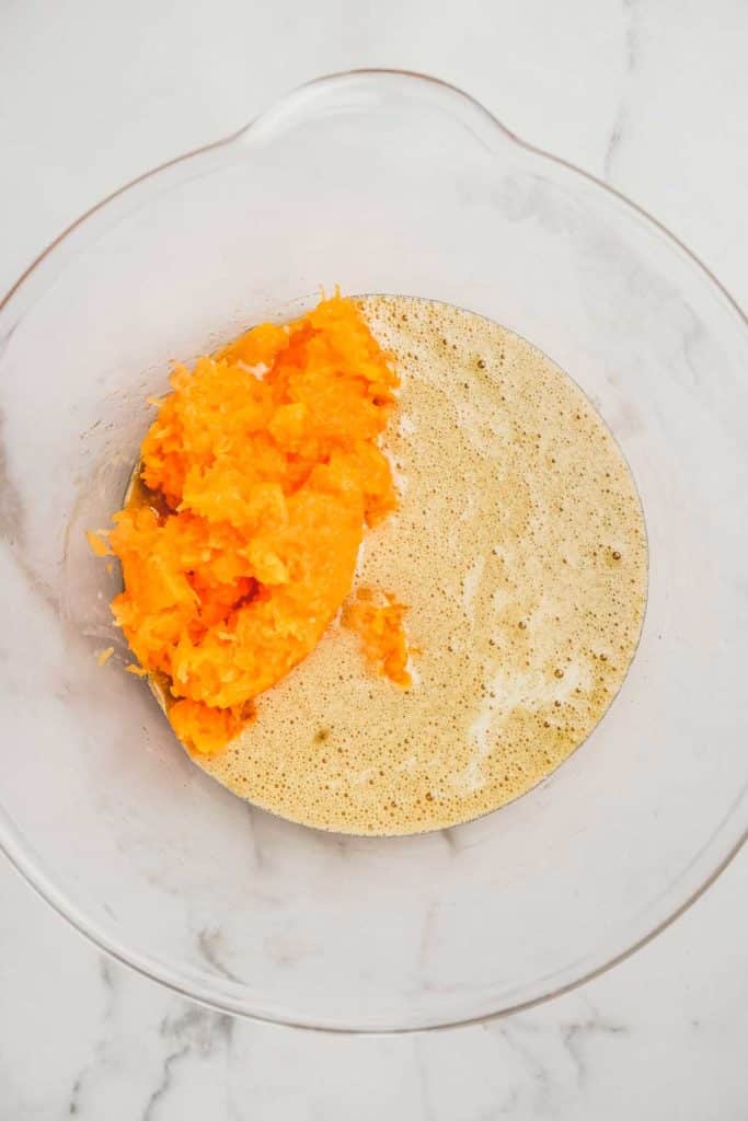 Pumpkin puree mixed into pumpkin muffin batter