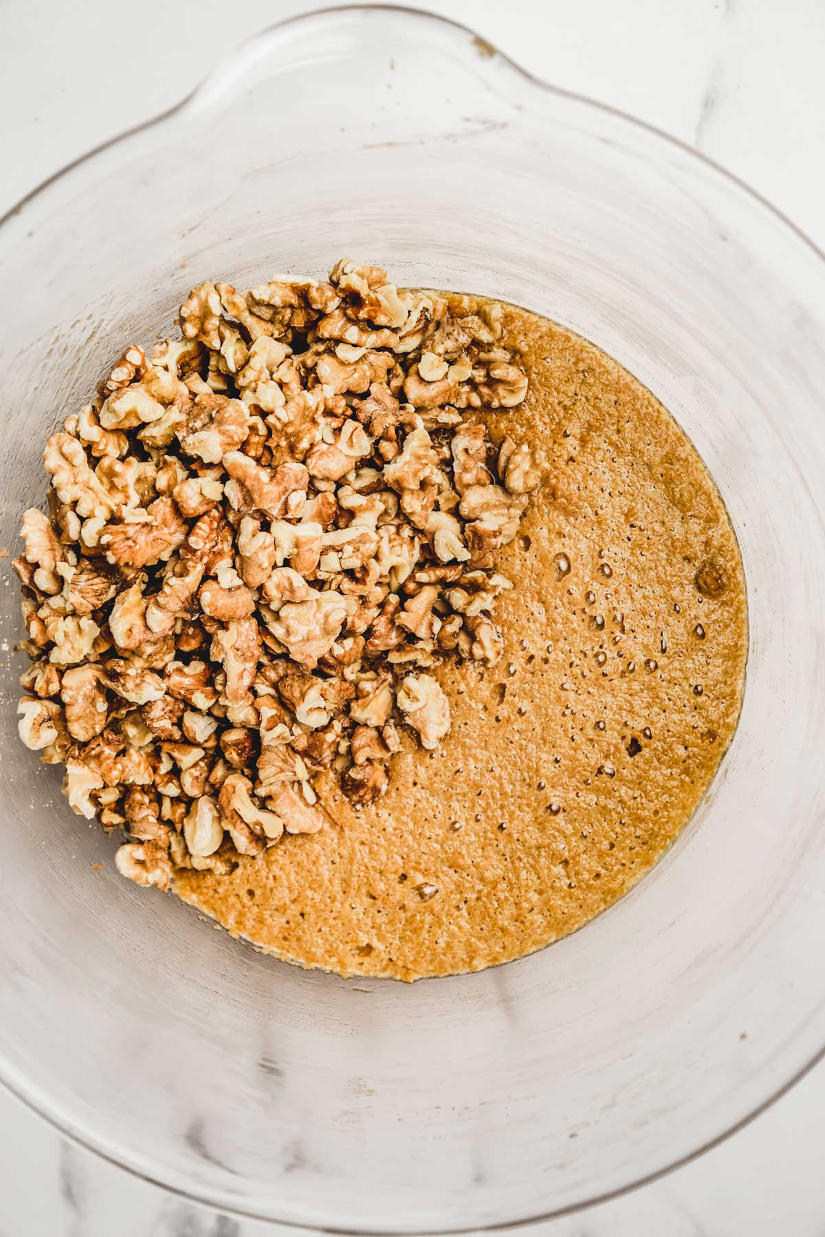 Large bowl with walnut pie batter