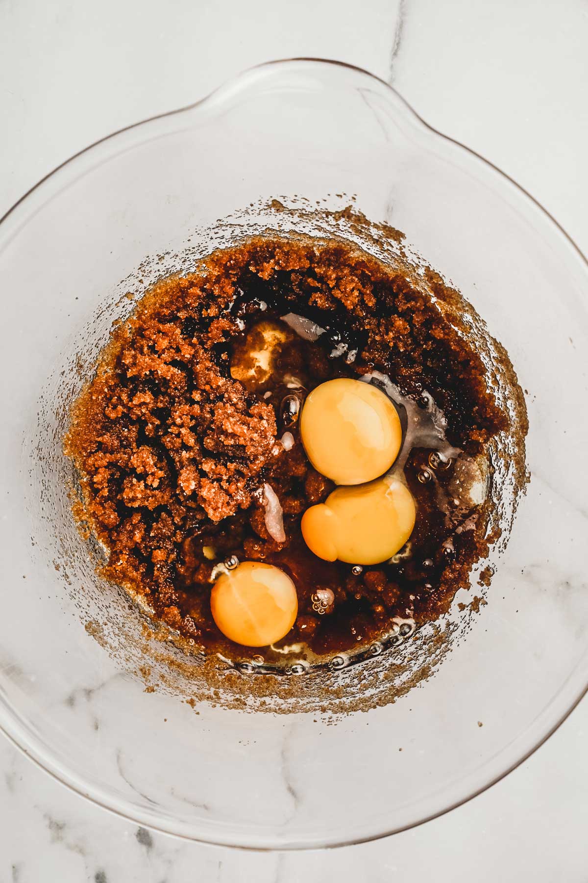 large bowl with ingredients and eggs