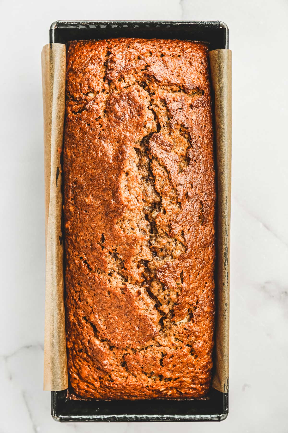 loaf pan with carrot brea after baking