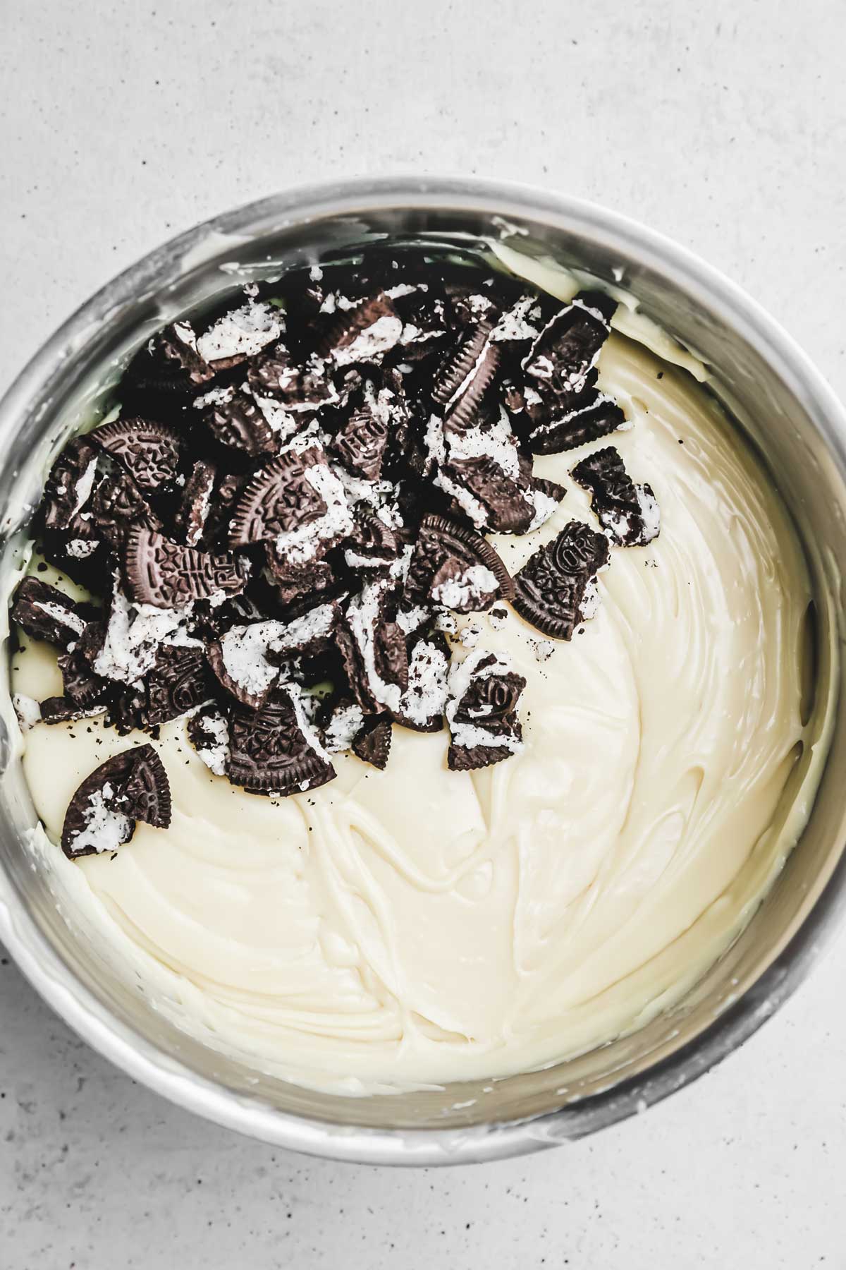 saucepan with fudge mixture and oreo pieces