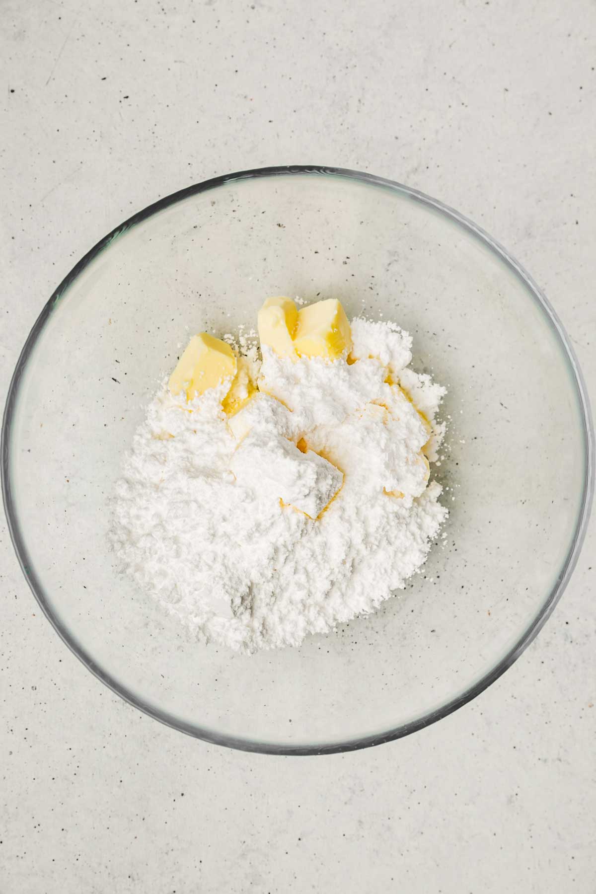 Bowl with diced butter and powdered sugar