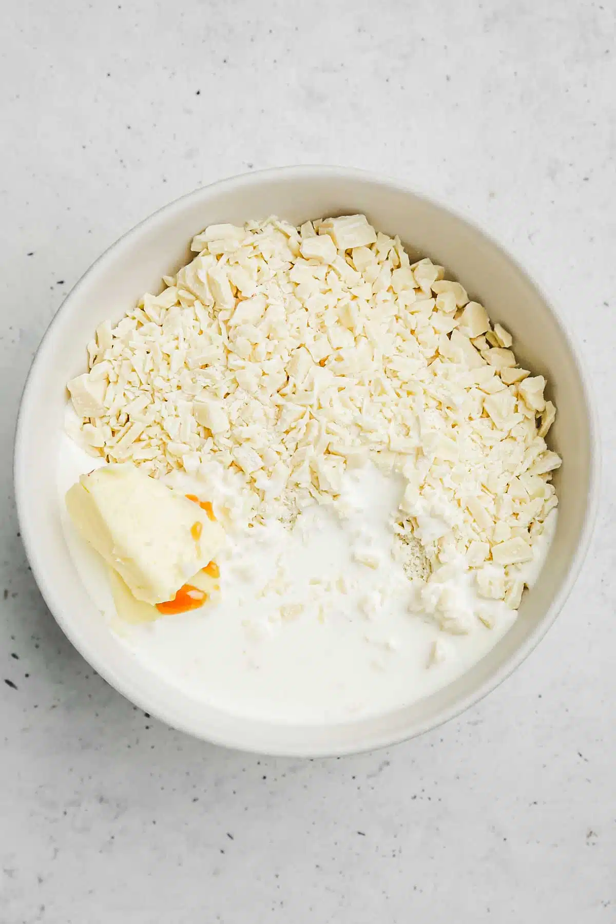 Bowl with white chocolate and cream