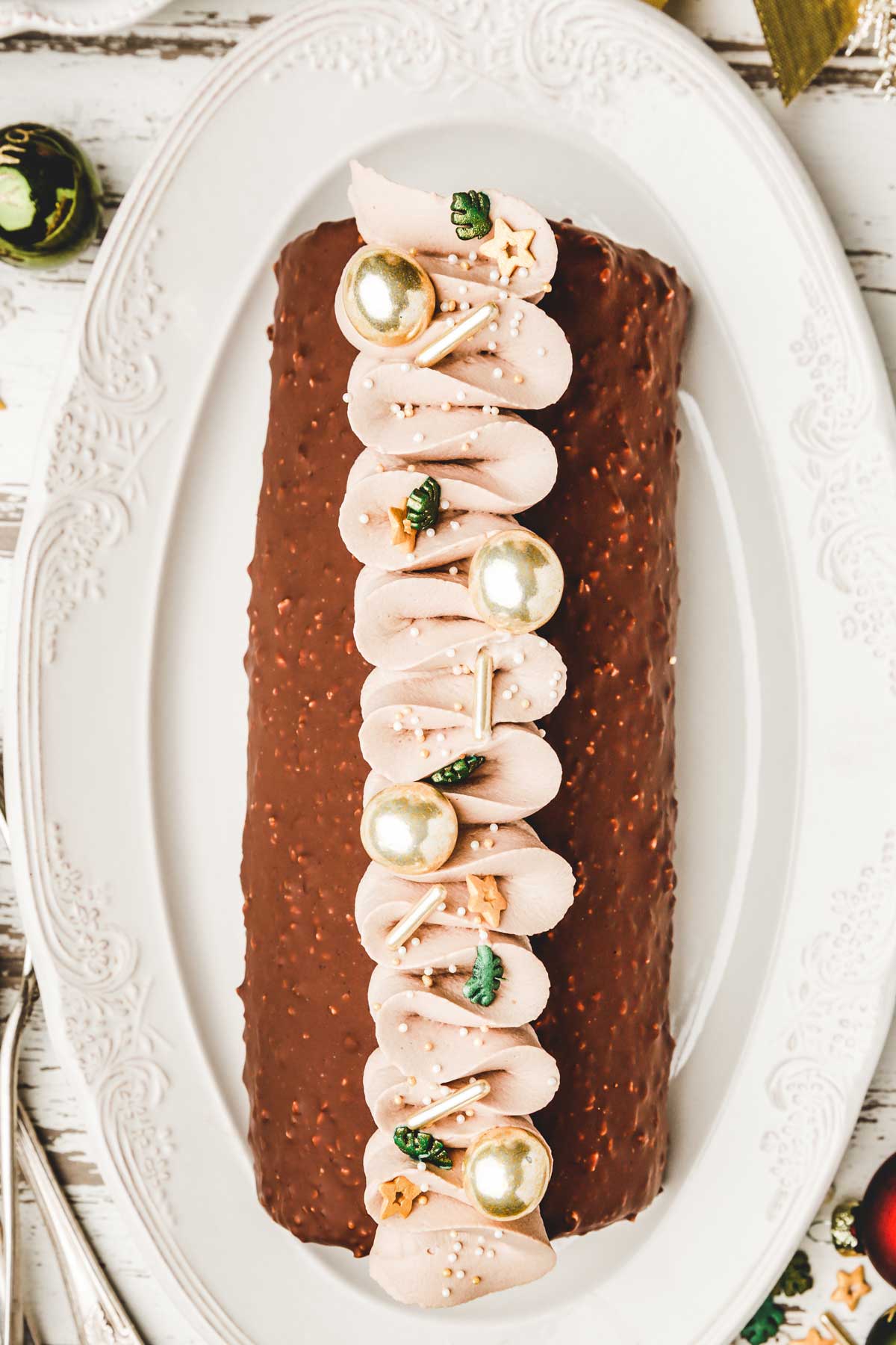 Chocolate yule log cake on a plate