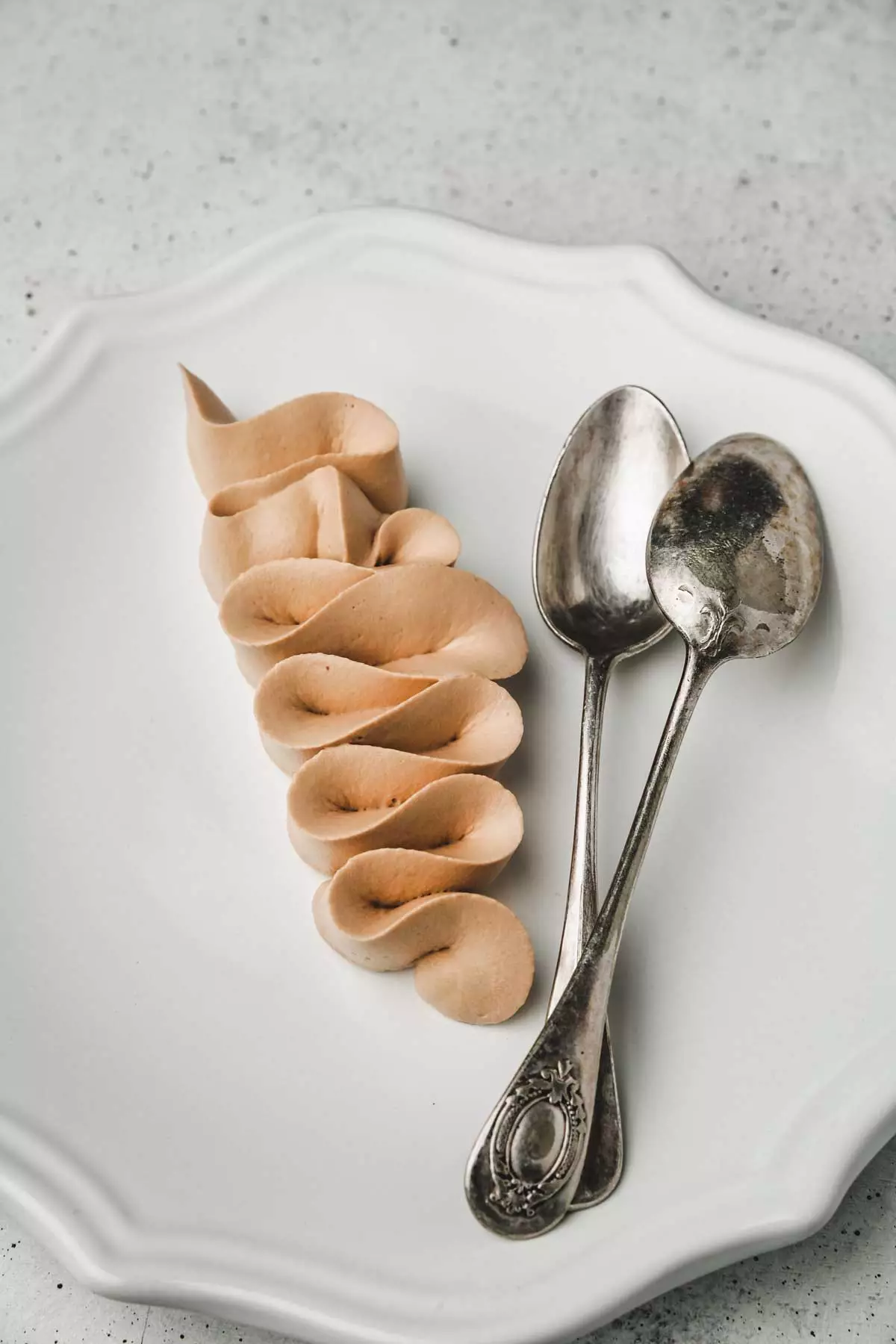 milk chocolate ganache on a plate with teaspoons