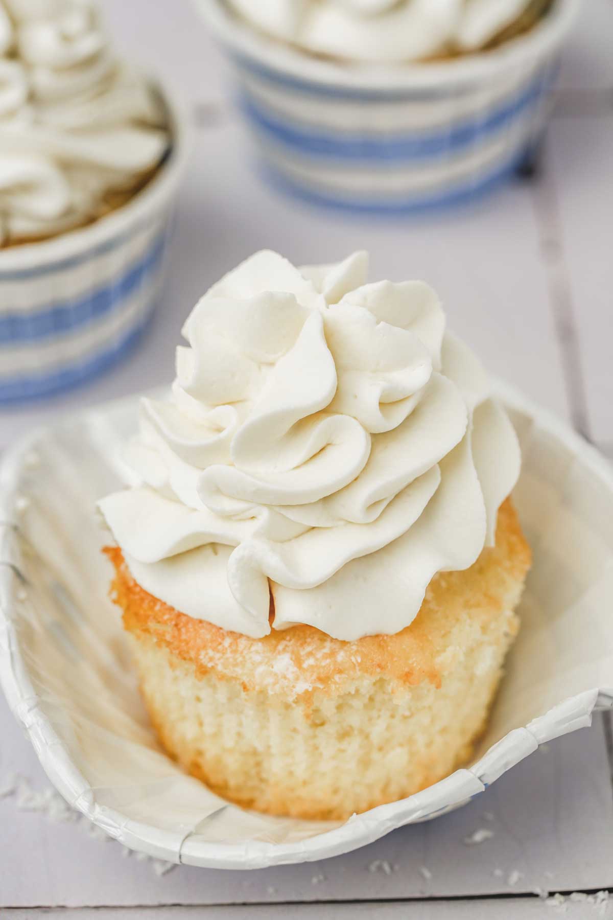 cupcakes topped with a whipped coconut frosting