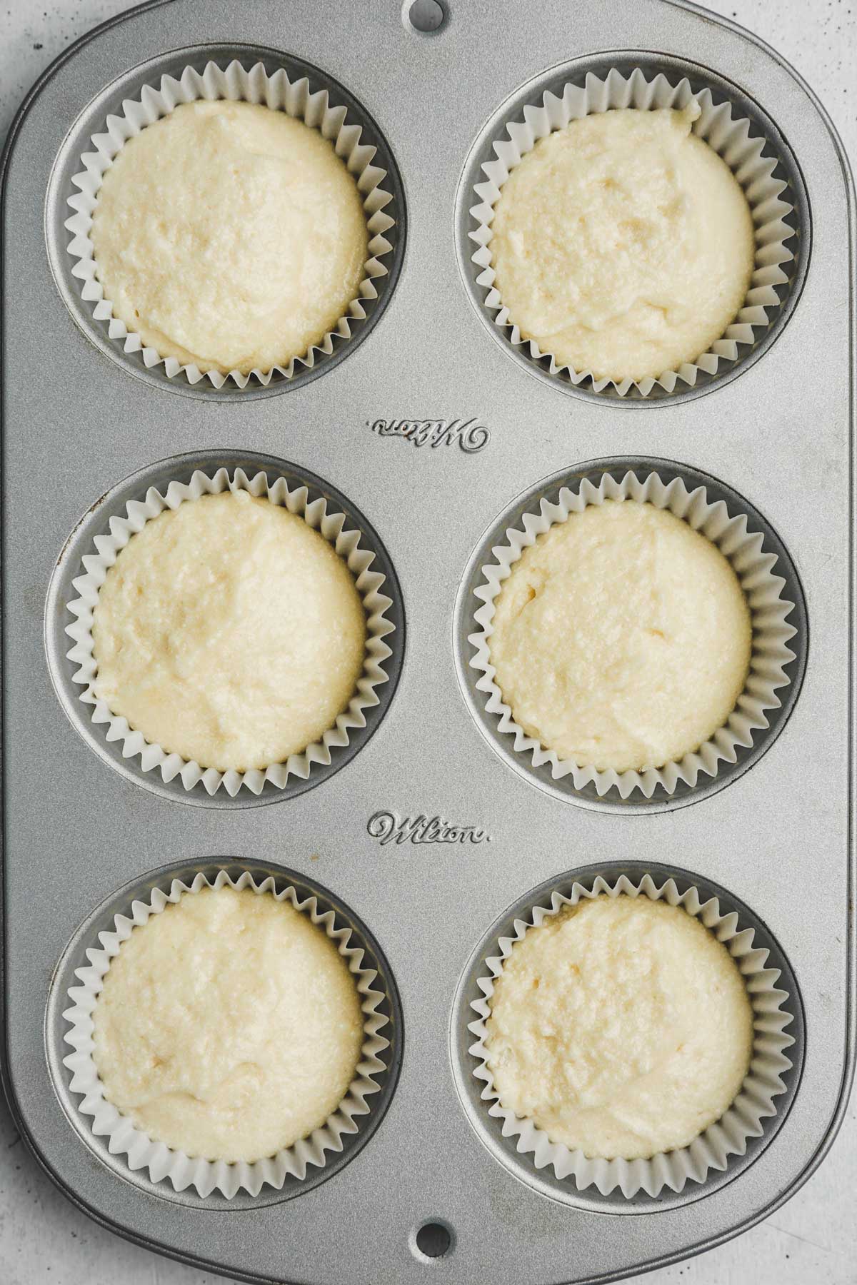 cupcakes pan with cupcake batter