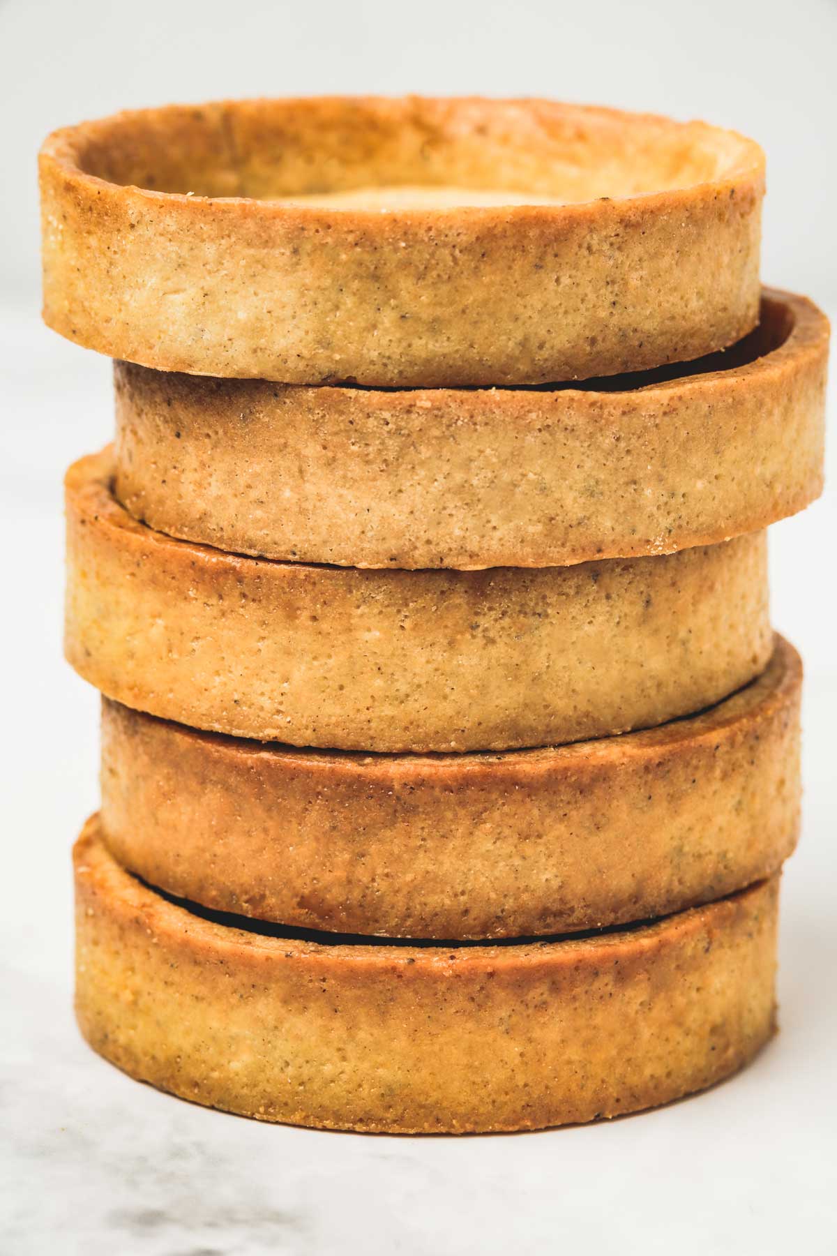 tartlet shells stacked on a table