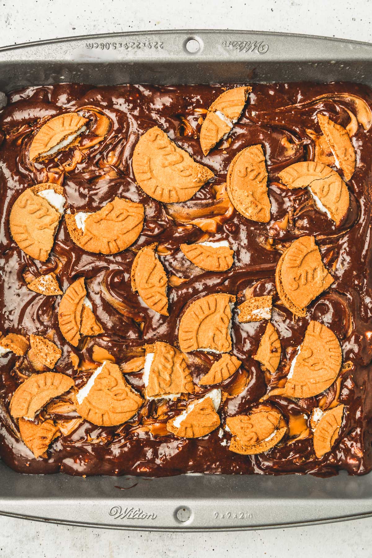 square pan with brownies batter