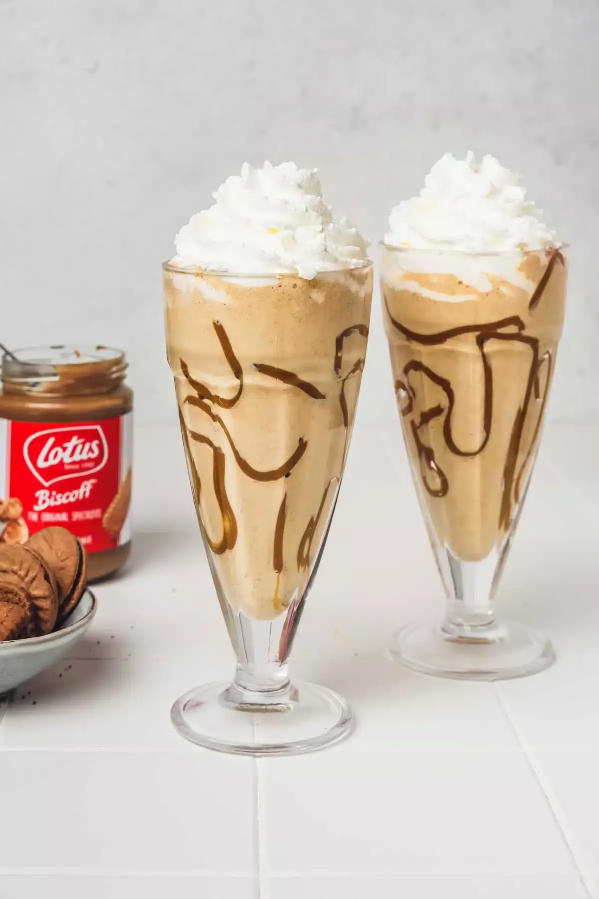 2 glasses of biscoff milkshake on a table