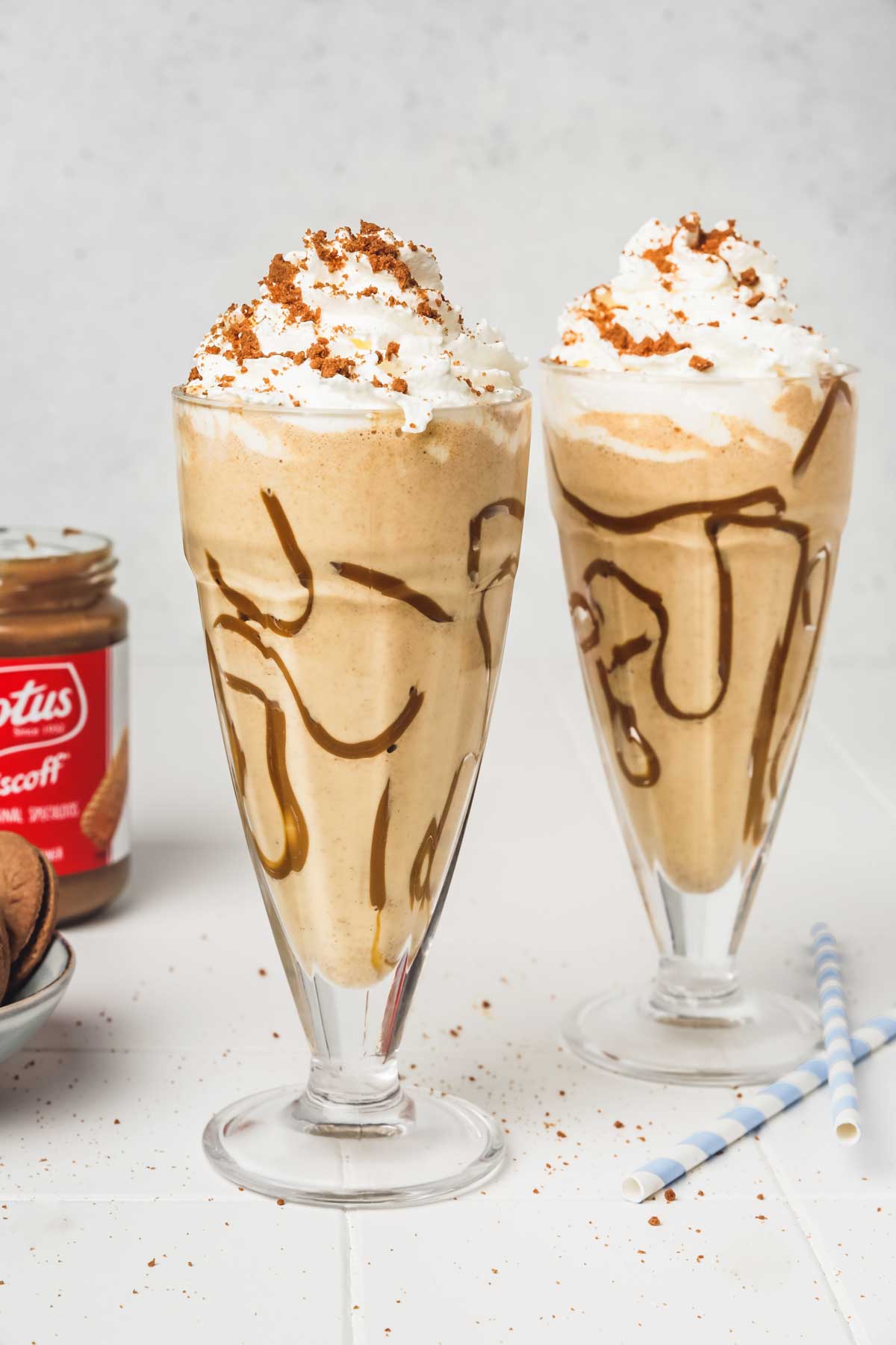 2 glasses of biscoff milkshake on a table