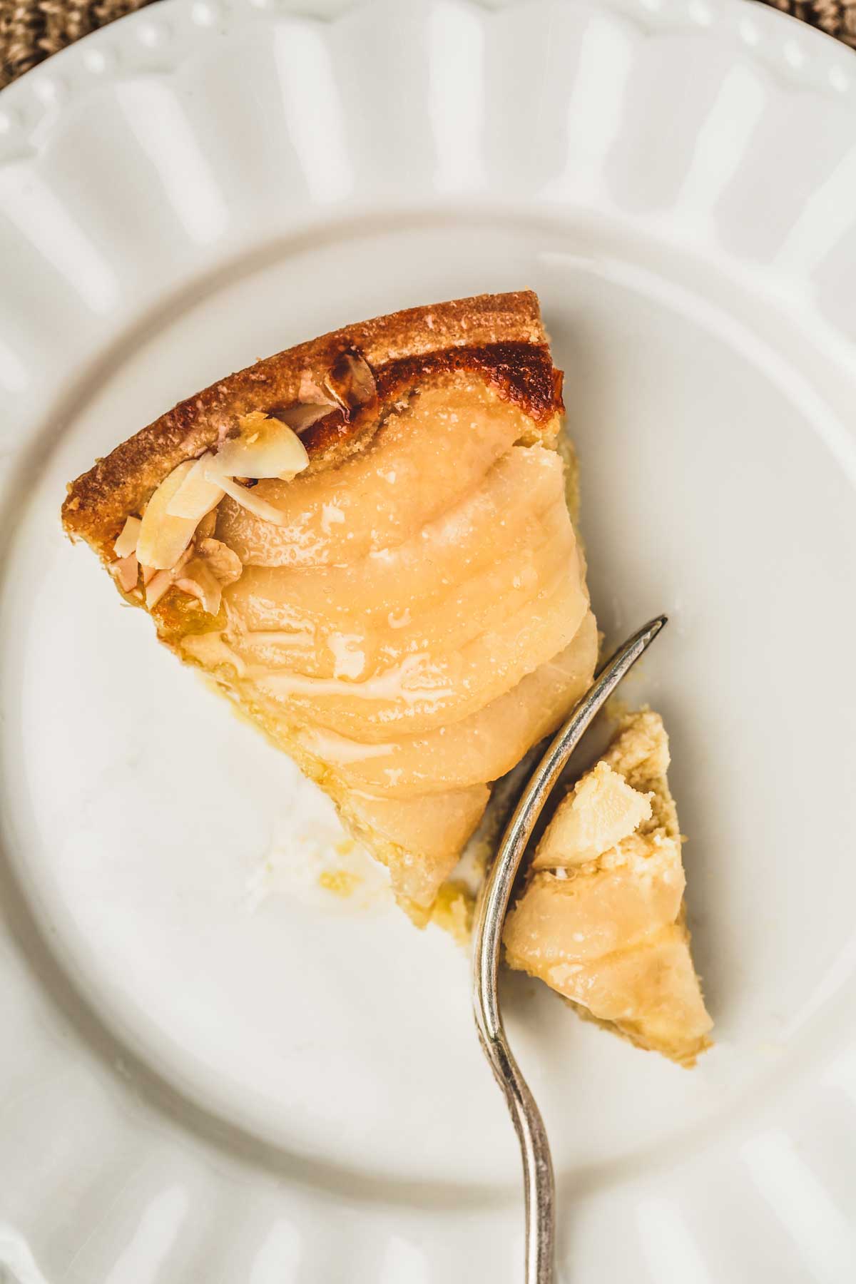 sliced pear tart with a fork