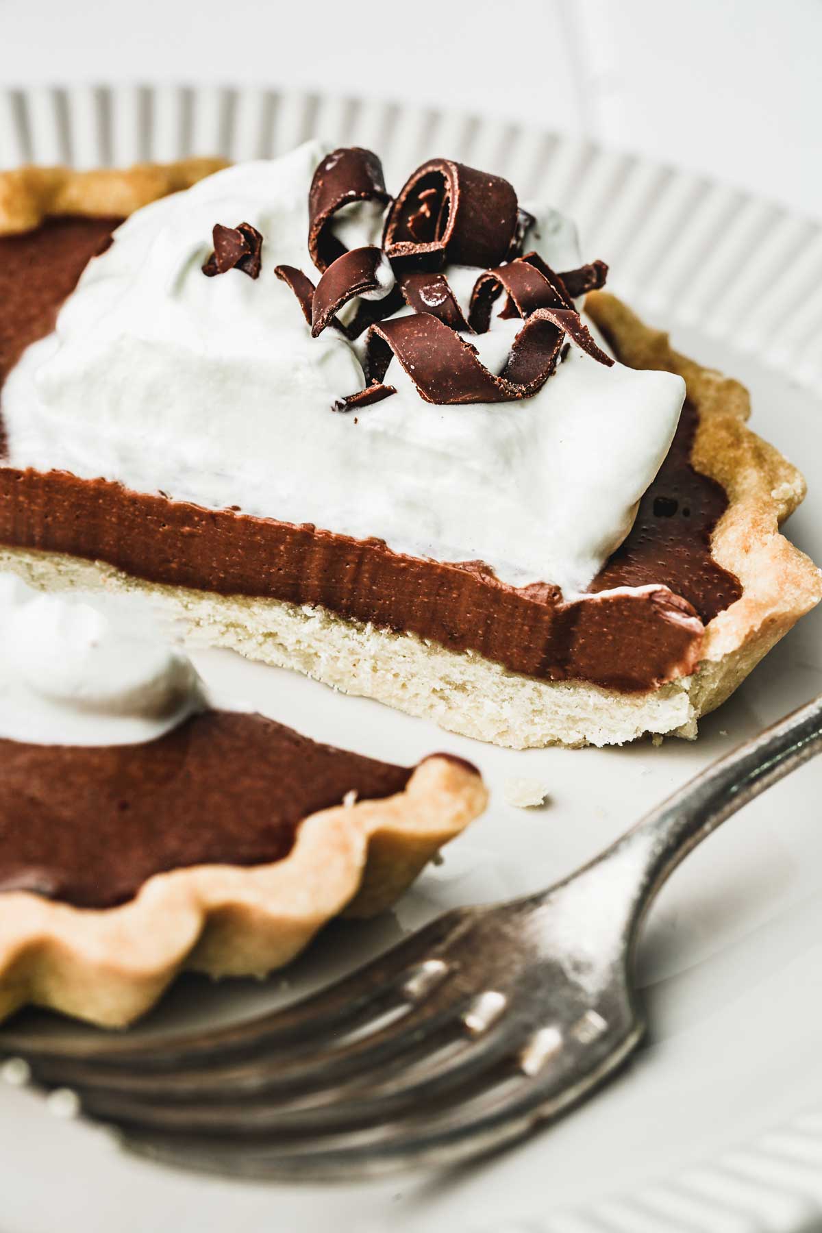 chocolate tartlet on a plate cut in half