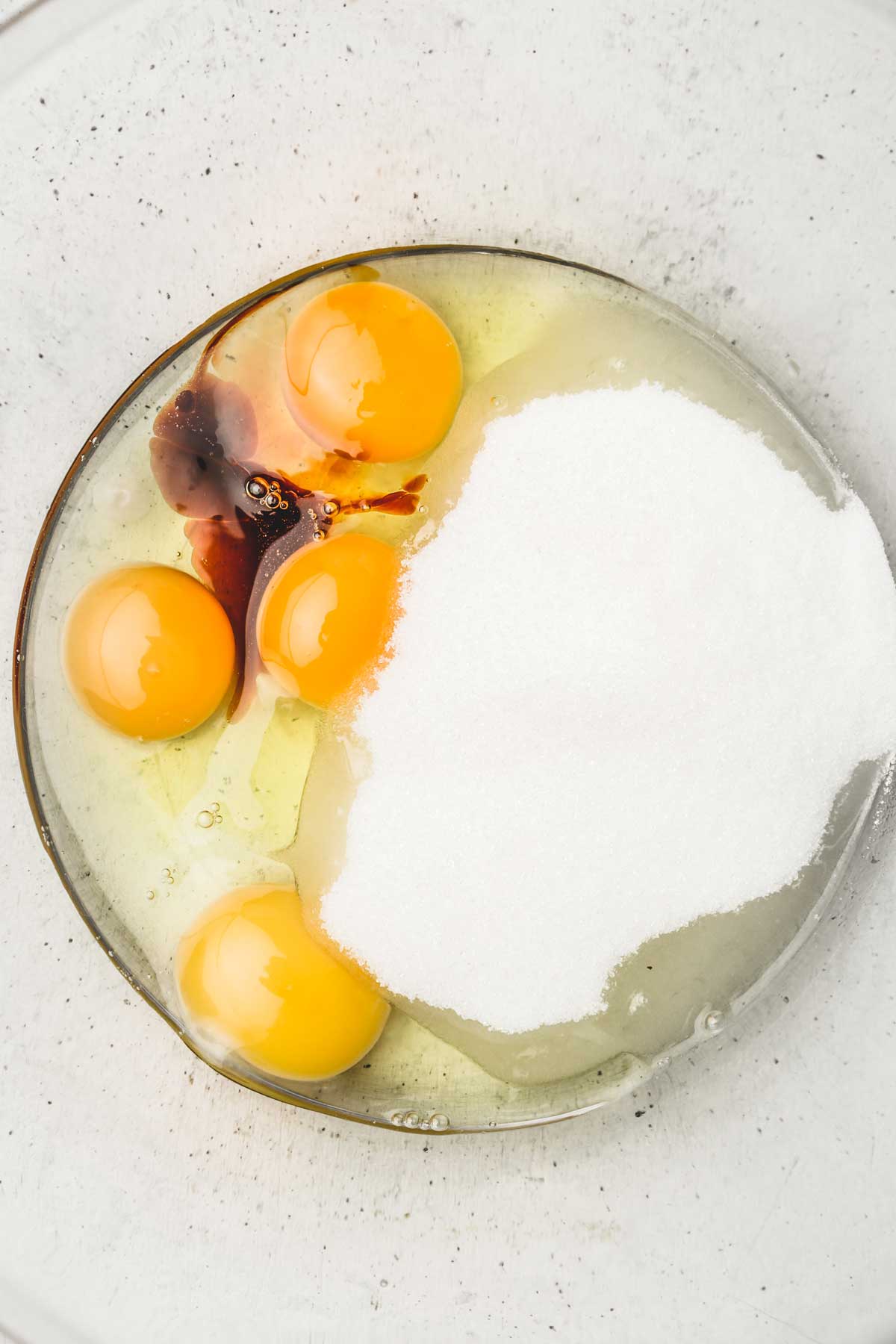 large bowl with eggs and sugar mixture for brownies