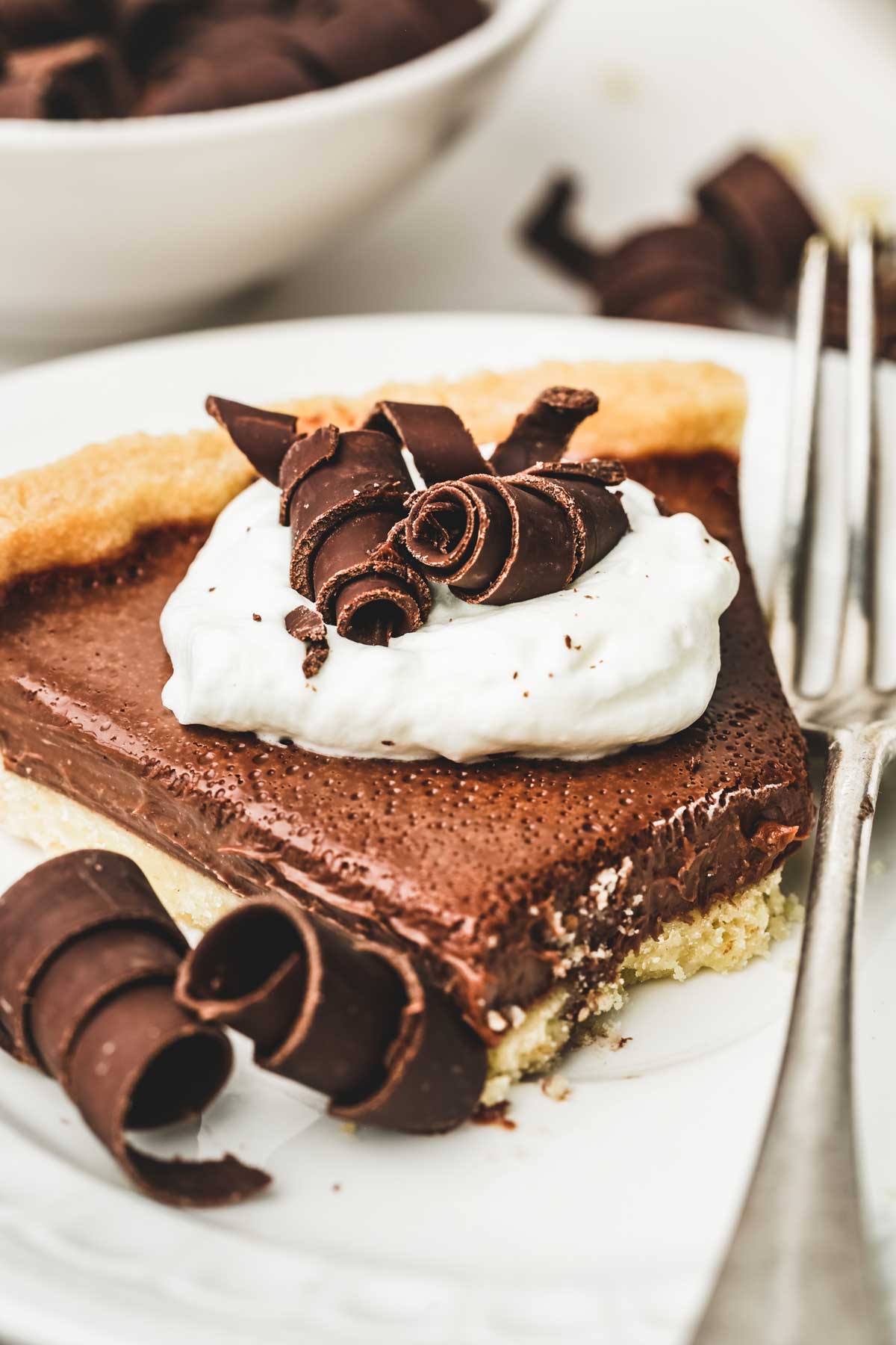 sliced chocolate tart on a plate
